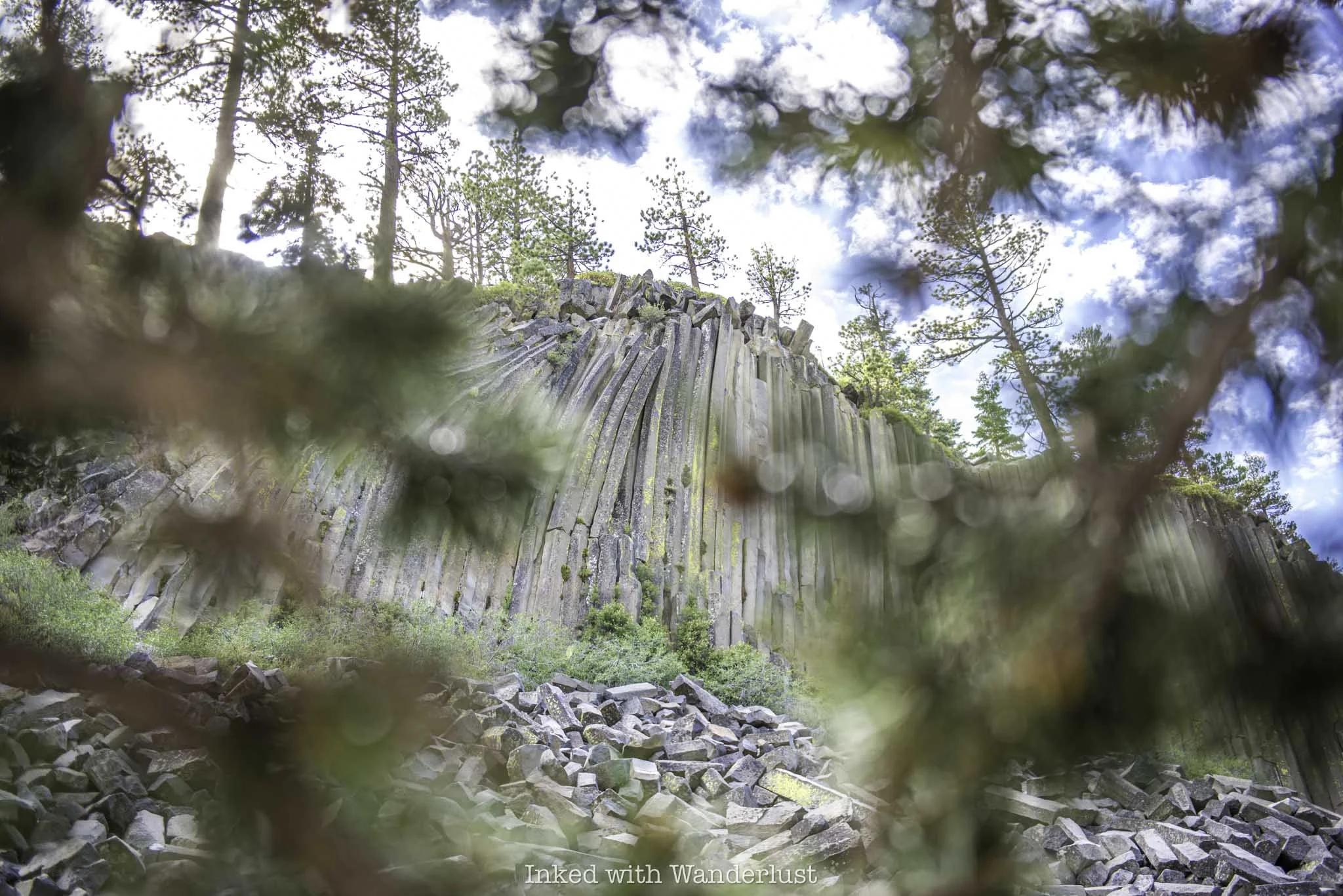 Devils Postpile as viewed through trees.
