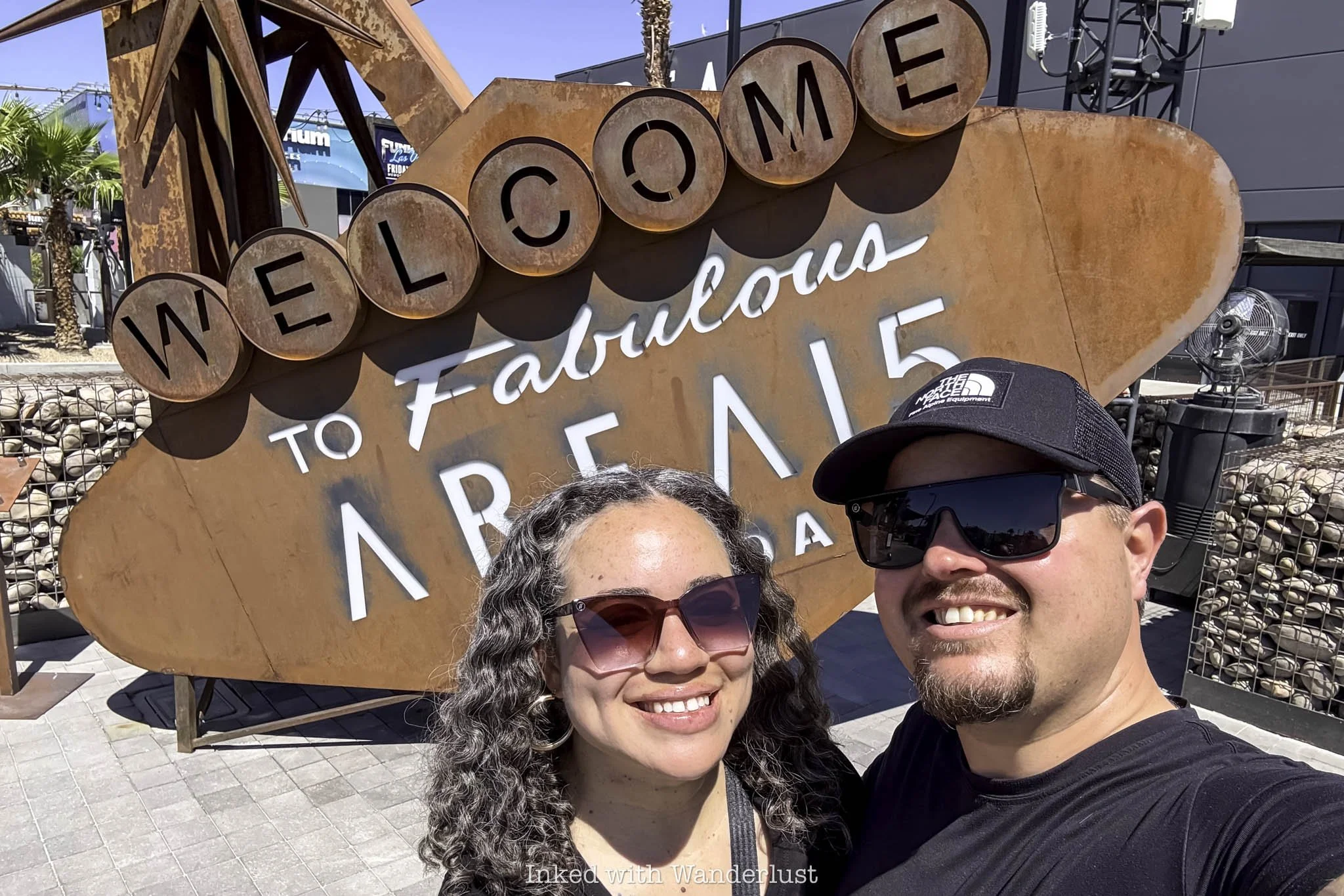 Two people at the entrance of Area 15 in Las Vegas.