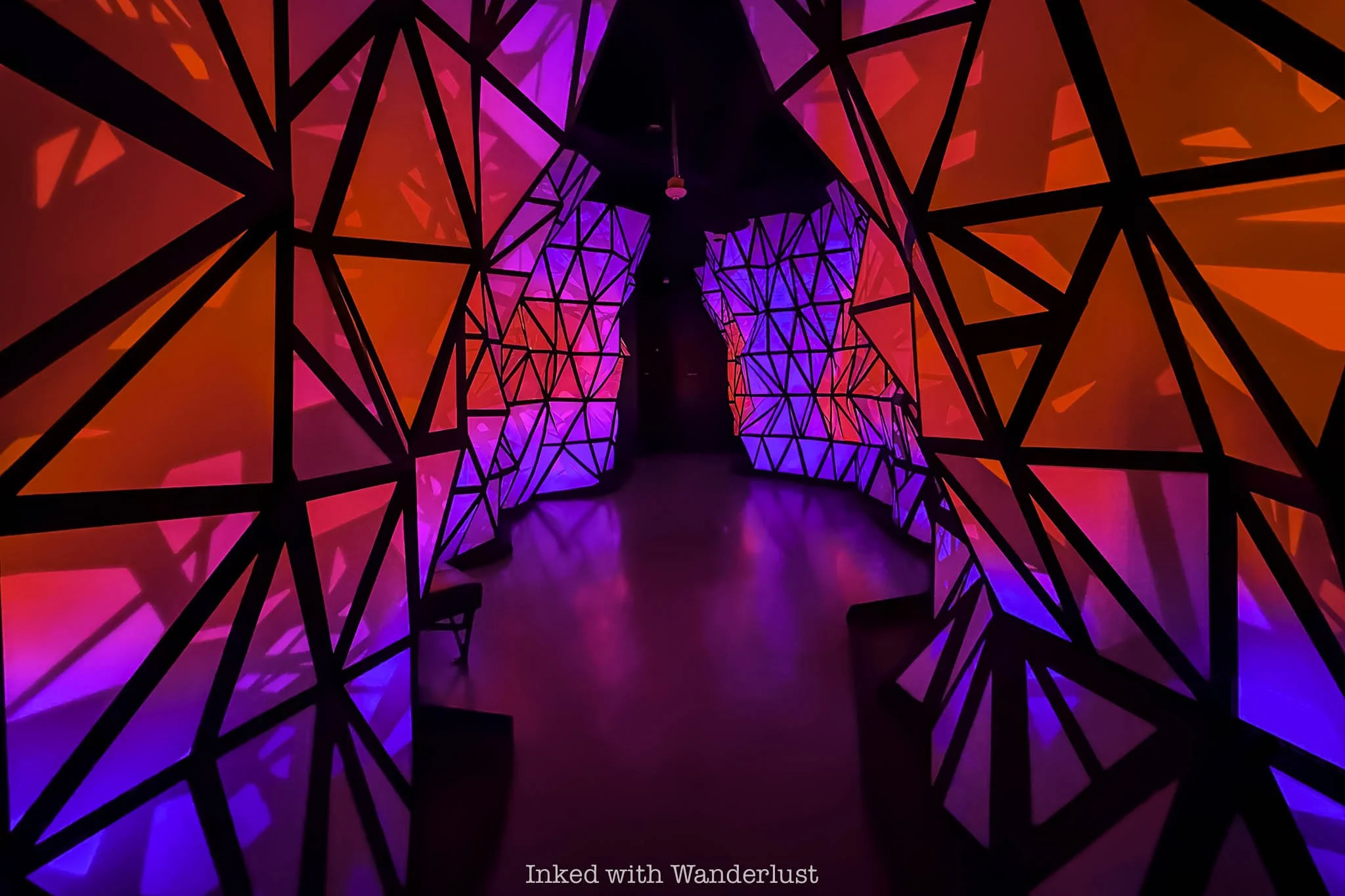 A multi-colored, 3D space inside Omega Mart Las Vegas.