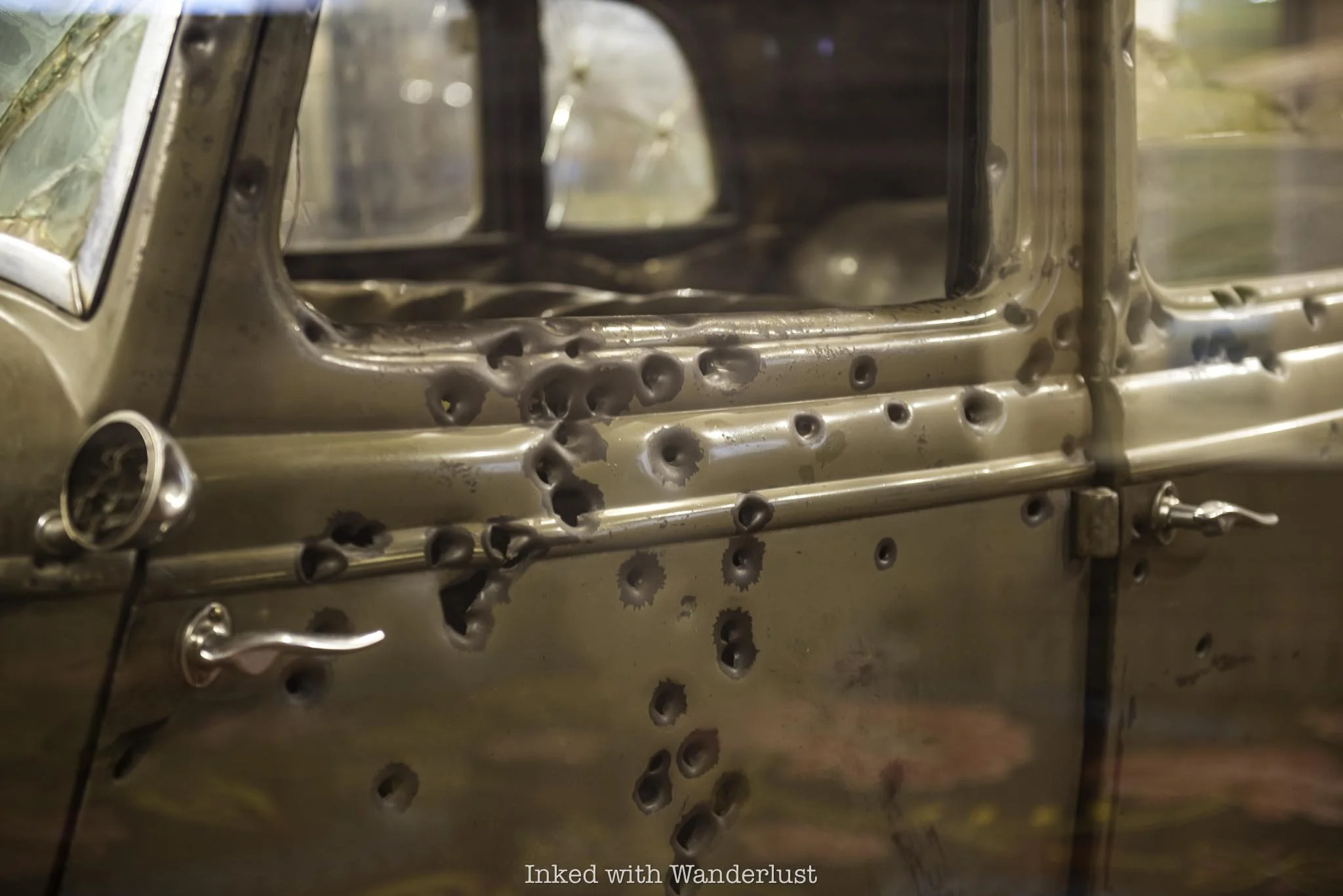The bullet-ridden driver side of the Bonnie and Clyde death car.