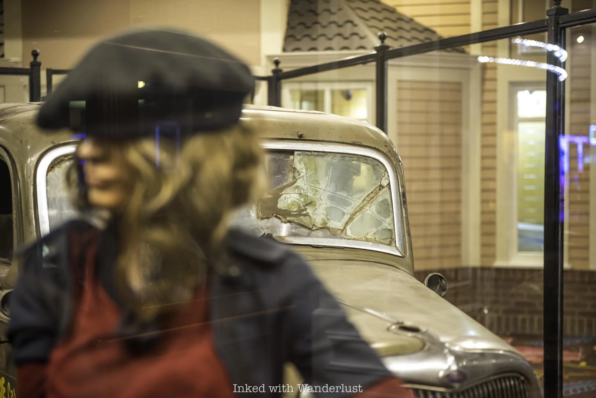 A mannaquin resembling Bonnie Parker at the death car exhibit.