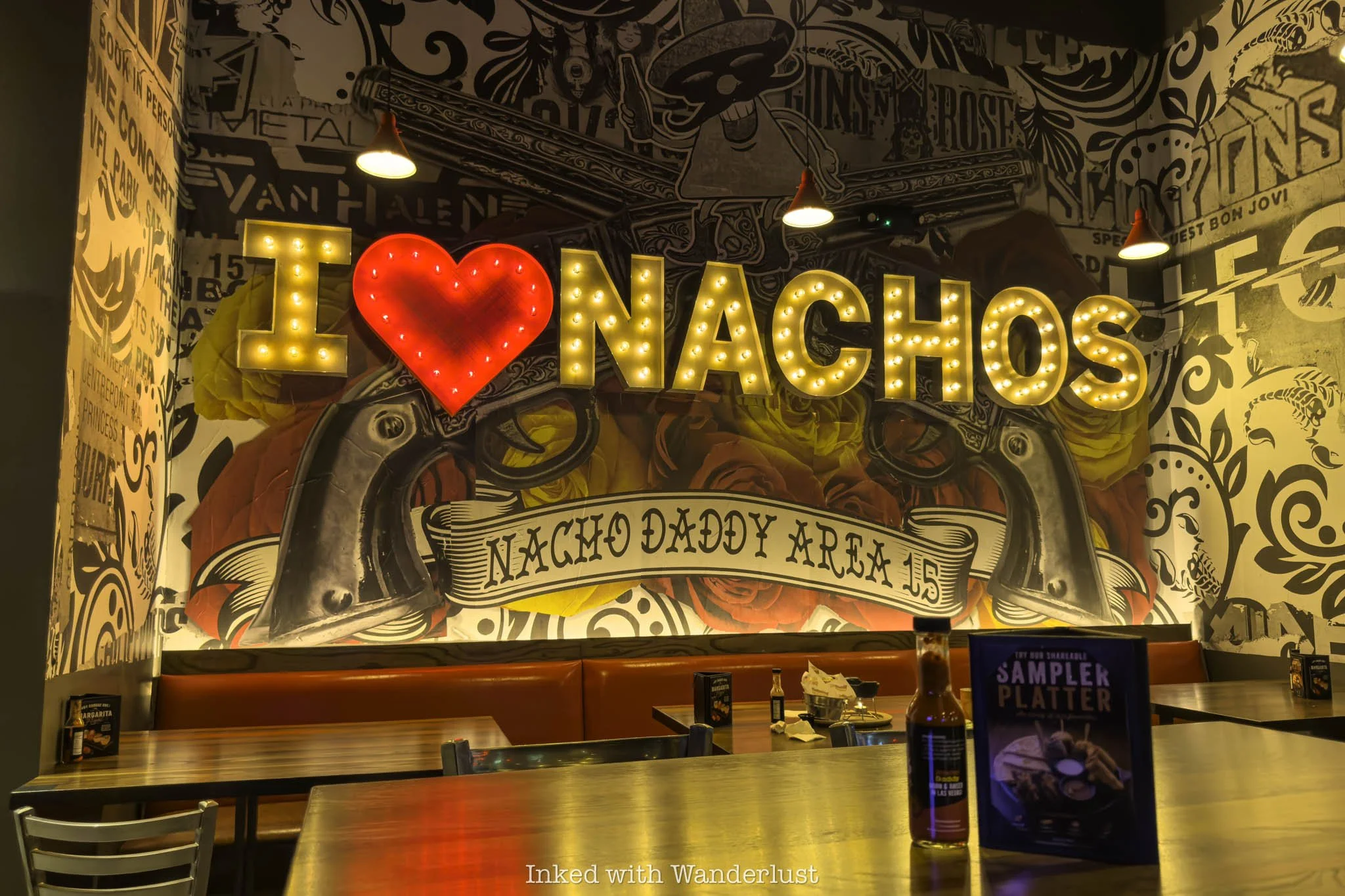 A I Love Nachos mural at Nacho Daddy Area 15 location.