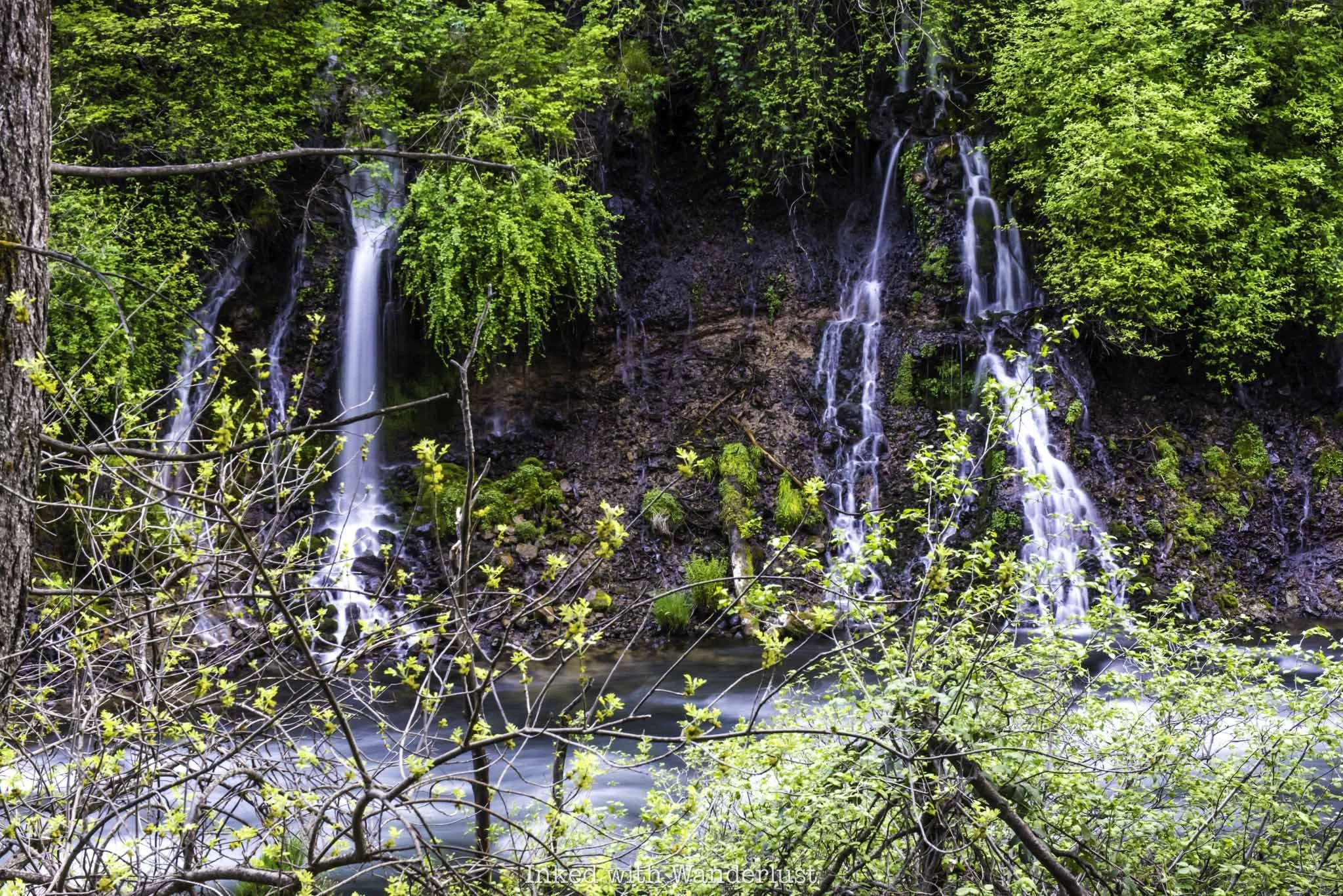 A close up view of the side of Burney Falls in California.