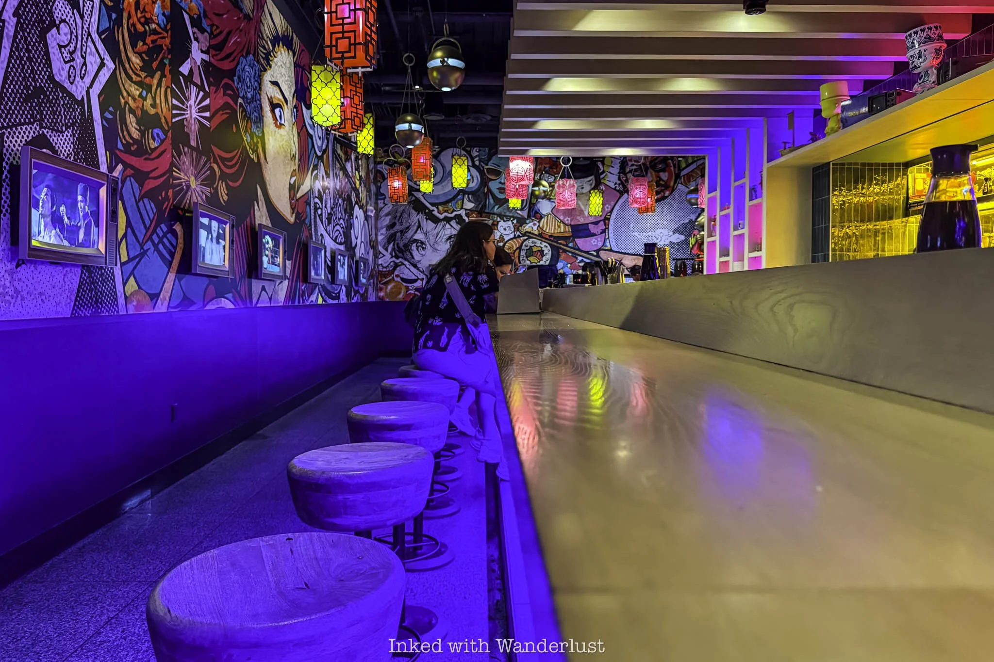 Guests sitting at the counter at Kaia restaurant in Las Vegas