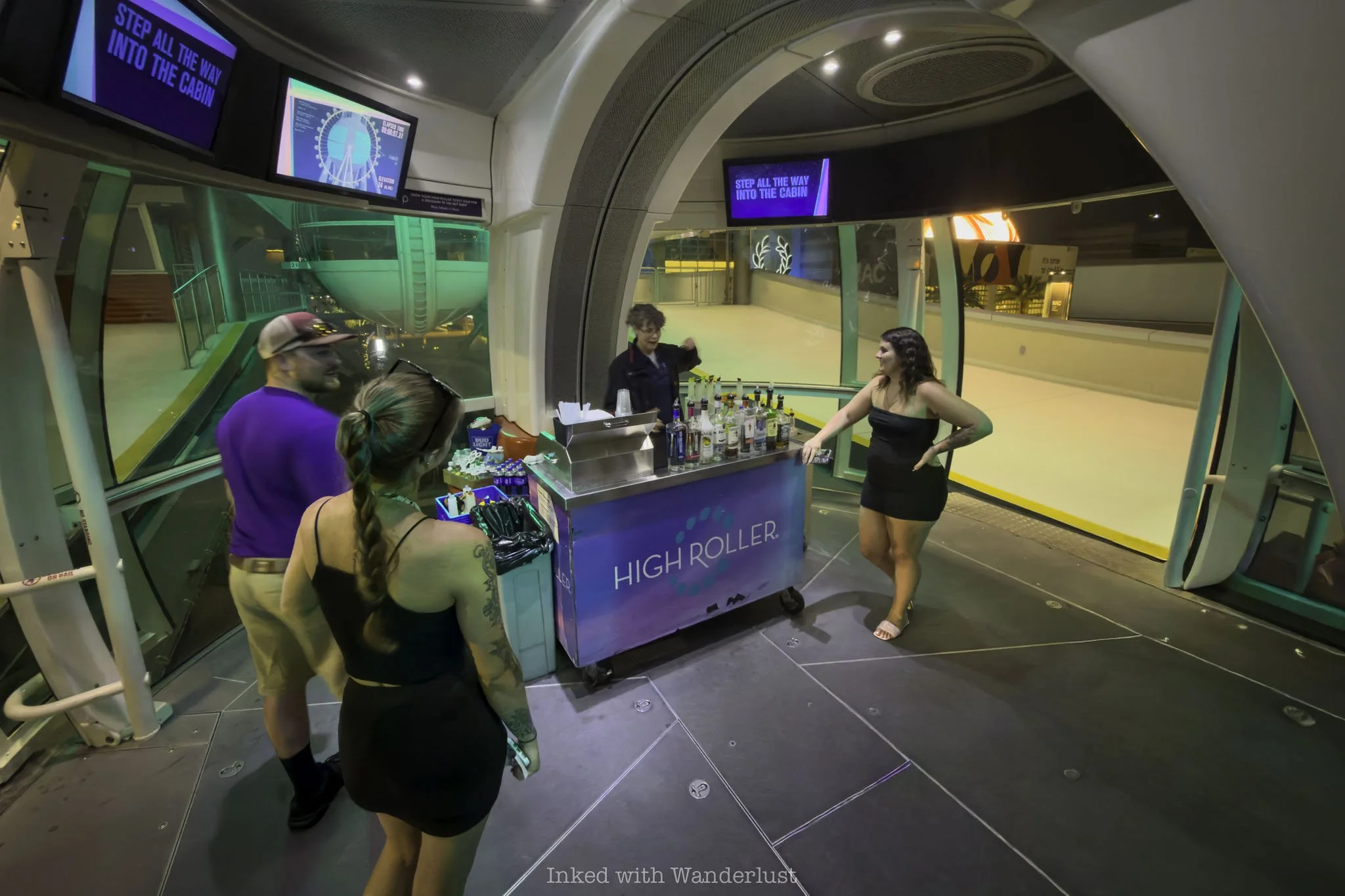 People inside a High Roller cabin.