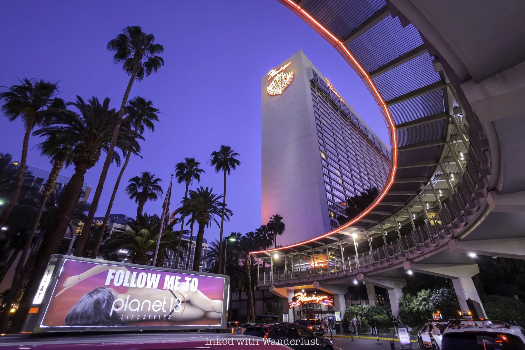 The exterior of the Flamingo Hotel Las Vegas during blue hour.