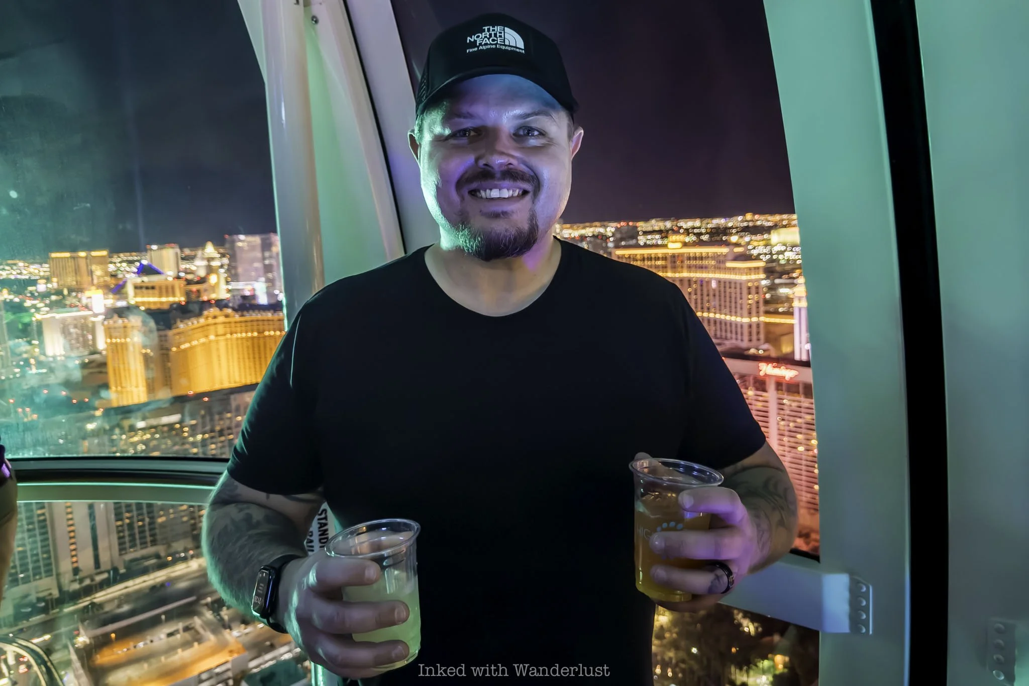 A person with cocktails on the High Roller in Las Vegas.