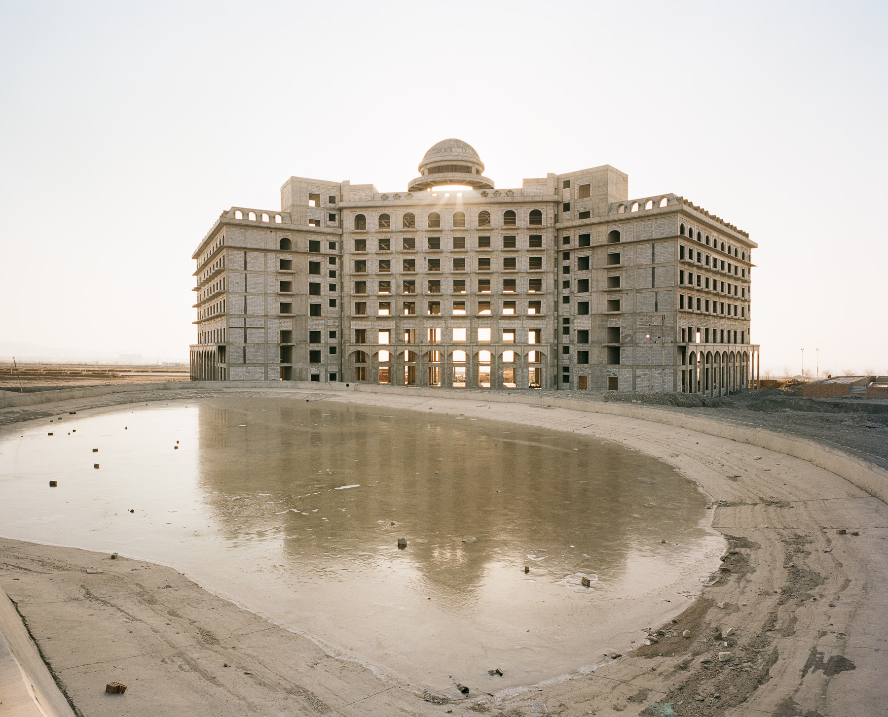  December 2016. Xinjiang province, China. Half constructed and decaying palace hotel in the new development zone of the city of Turpan in Xinjiang. 