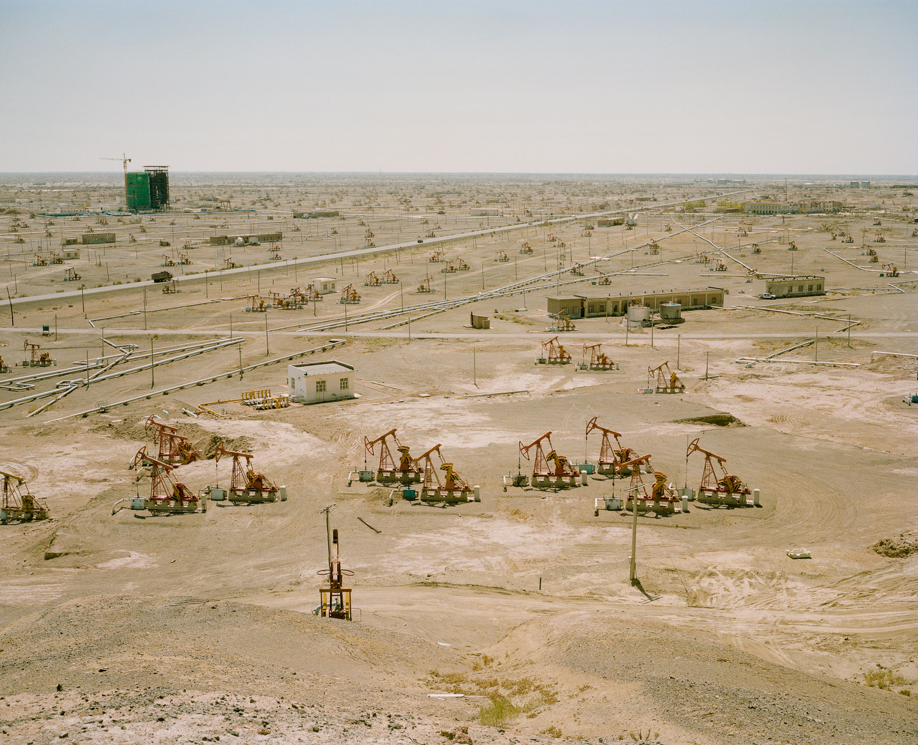  May 2017. Xinjiang province, China. View of the pumps in the oil field in the outskirts of the city of Karamai. 