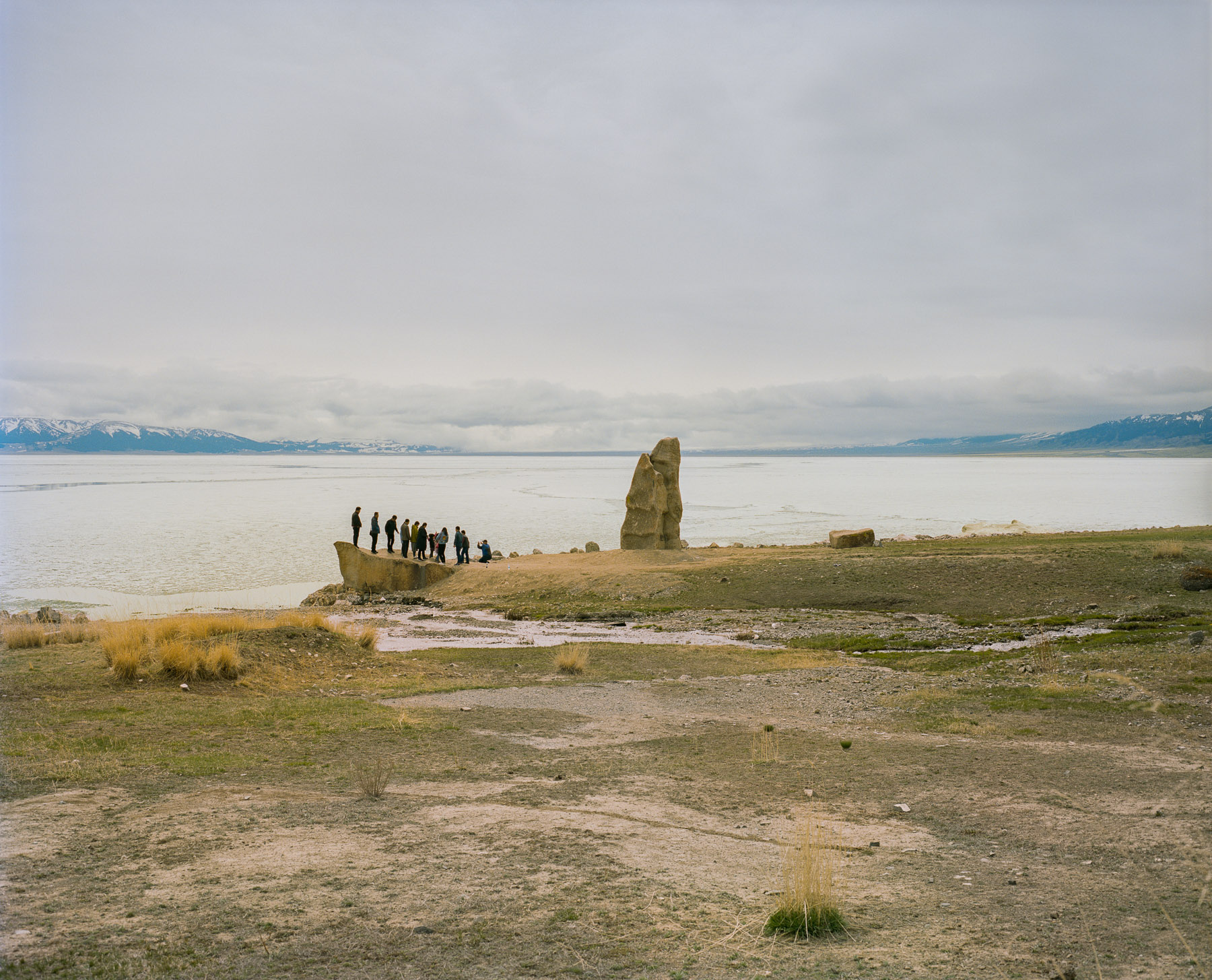  May 2017. Xinjiang province, China. View of Sayram lake in northern Xinjiang. Han Chinese tourists posing for a group photo.  