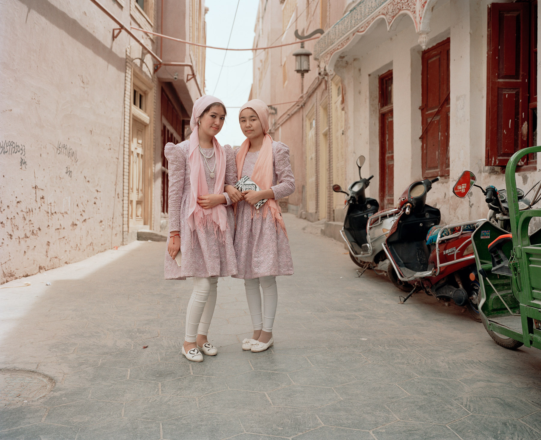  May 2016. Xinjiang province, China. Two Uighur girls inside the old city of Kashgar.  