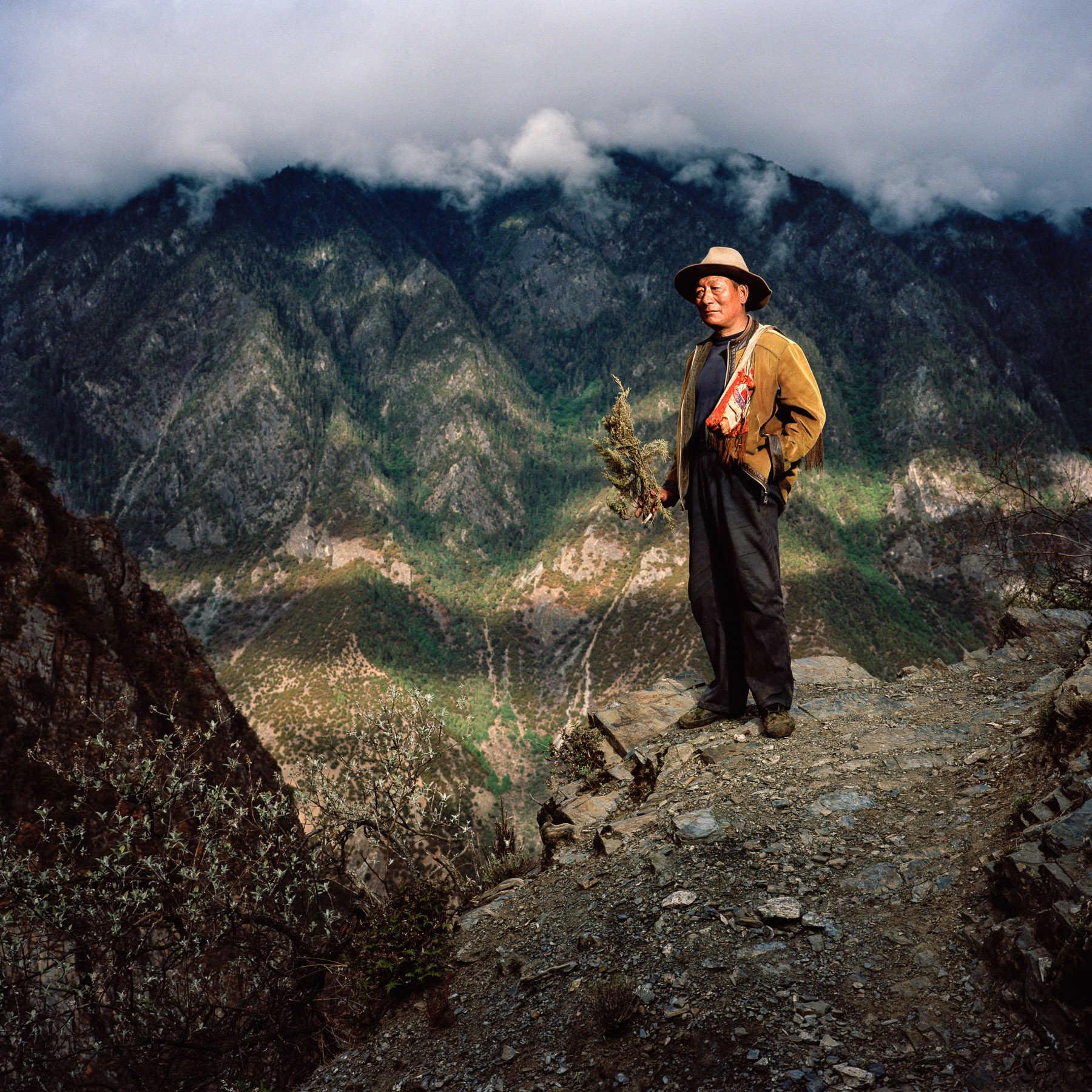  May 2012. Tibet province, China. Portrait of a Tibetan farmer from the village of Laide at 3100m high on the trail of the buddhist pilgrimage of the Kawa Karpo. After several days camping on the mountains on the trail of the pilgrimage, we made it t