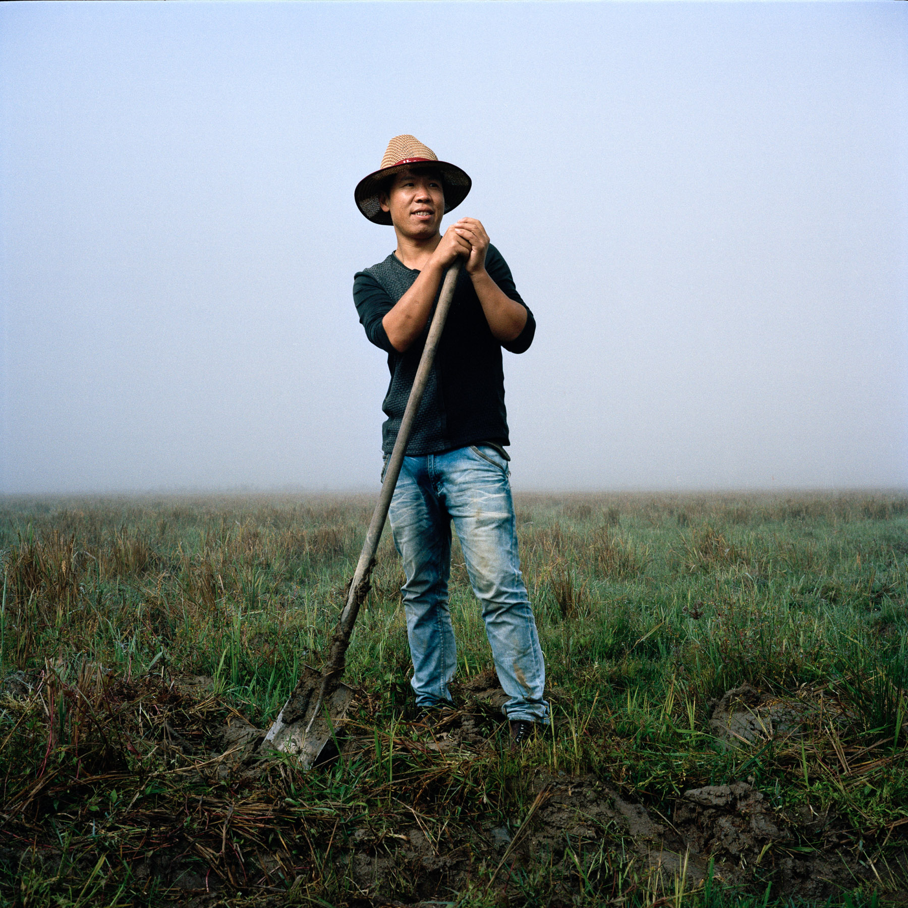  China, Yunnan province. Southern region of Xishuangbanna. November 2nd 2013. Pan Tian Song is a 40-year old Han Chinese farmer who moved with his family from the city of Wenzhou in Zhejiang province (East Coast of China near China) to Yunnan. 