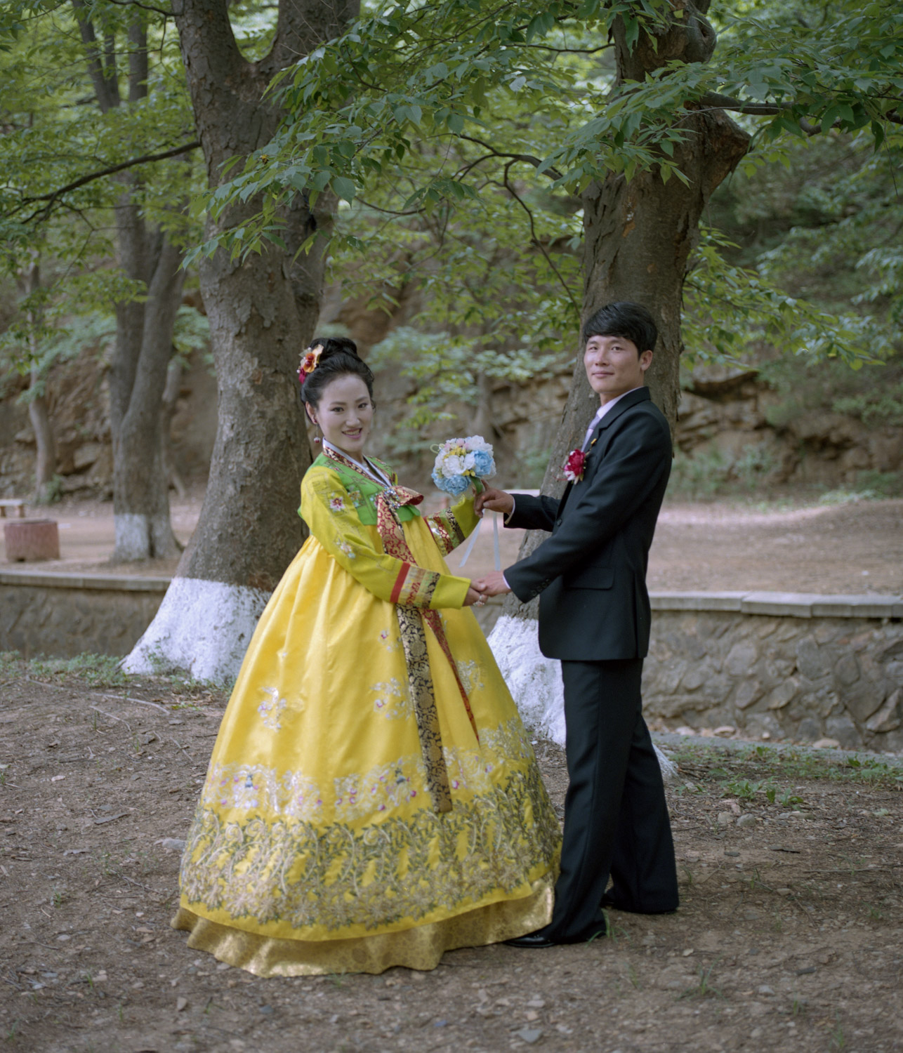  newly weds posing for their photos in a parc in the Sariwon Region. 