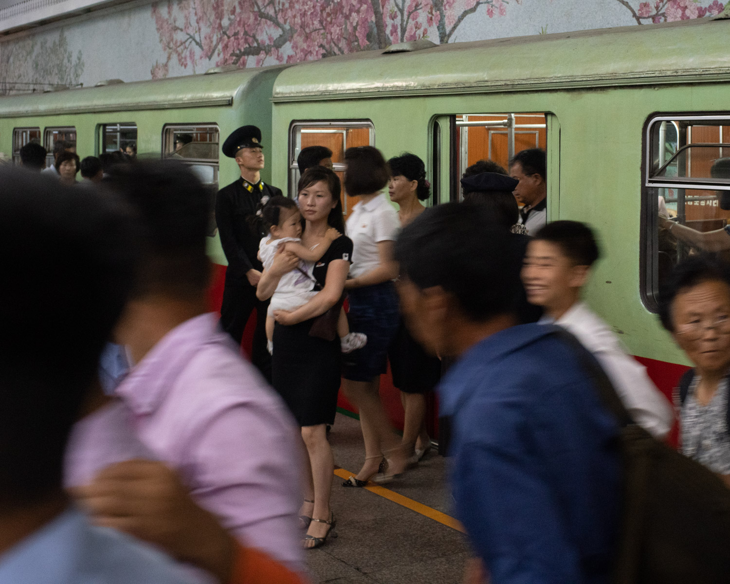  Passenger exiting the a subway car in downtown Pyongyang. 