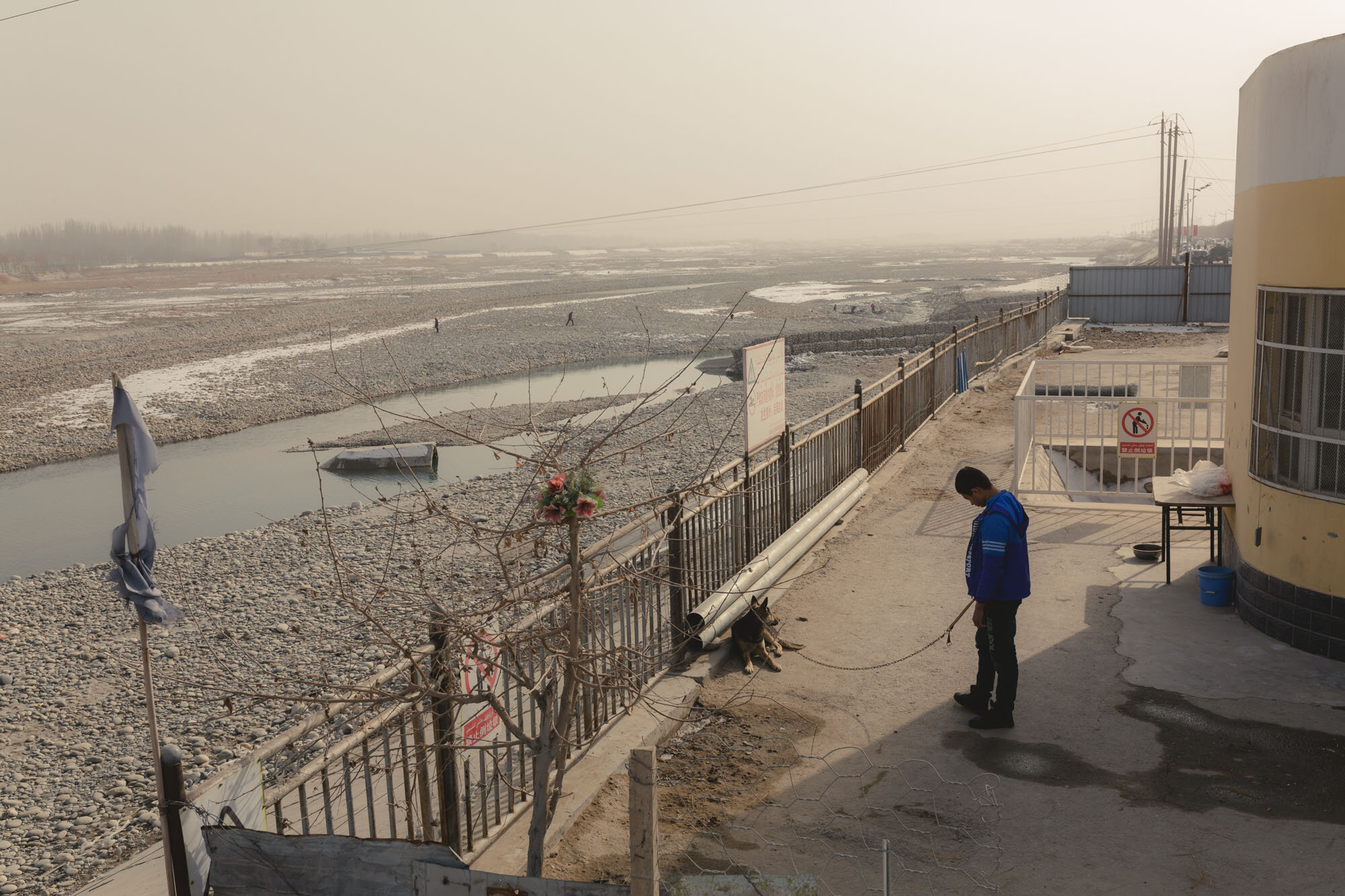  February 3rd 2019. Hotan, Xinjiang province. View over the White Jade river - also known by the native name of Yurungkash - from the road. The river gets its name from the white jade often found in its alluvial deposits. Hotan is famous for this whi