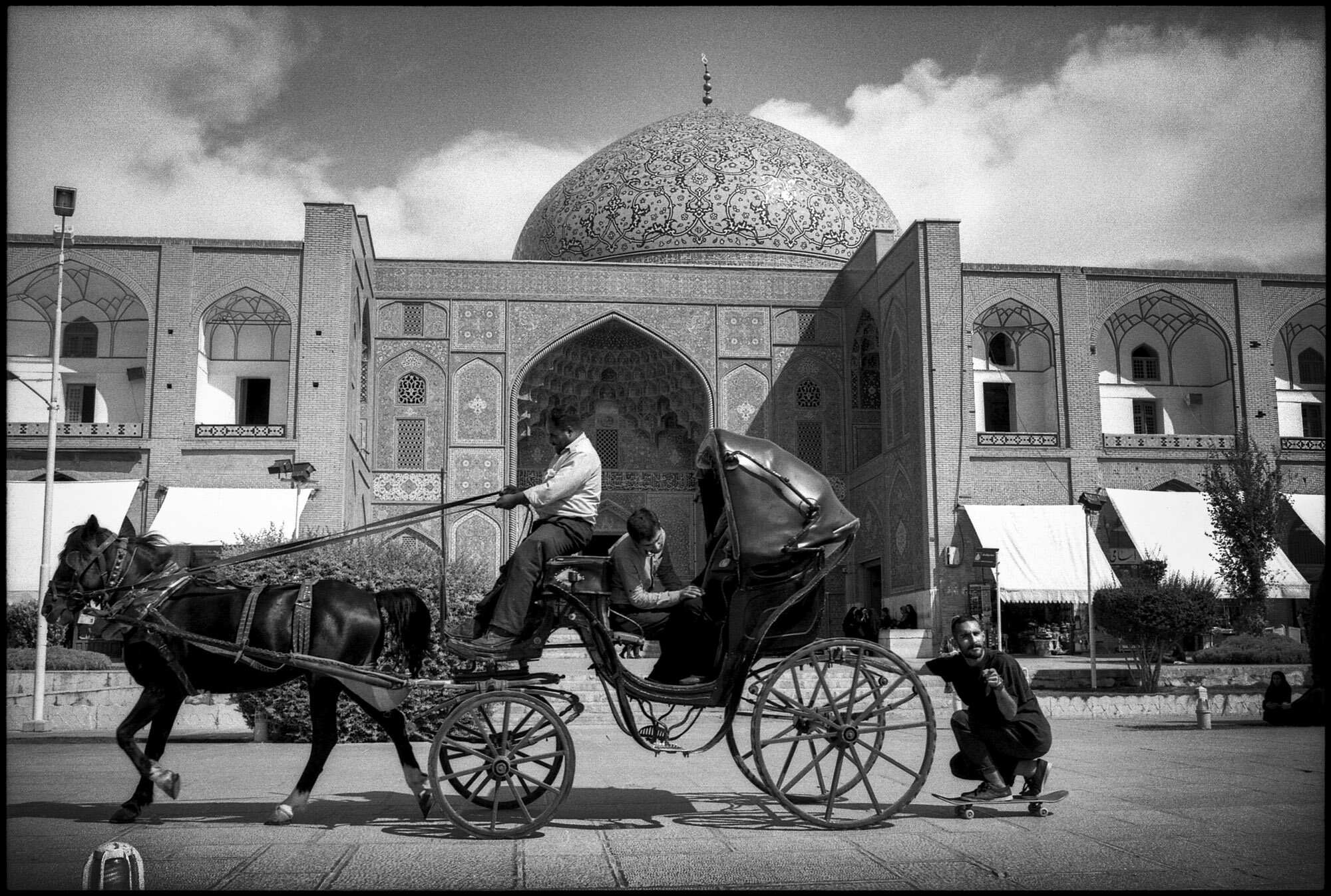  Erfan is towed by a horse-drawn carriage on Naghsh-e Jahan square in Isfahan, Iran, on September 28, 2015. 