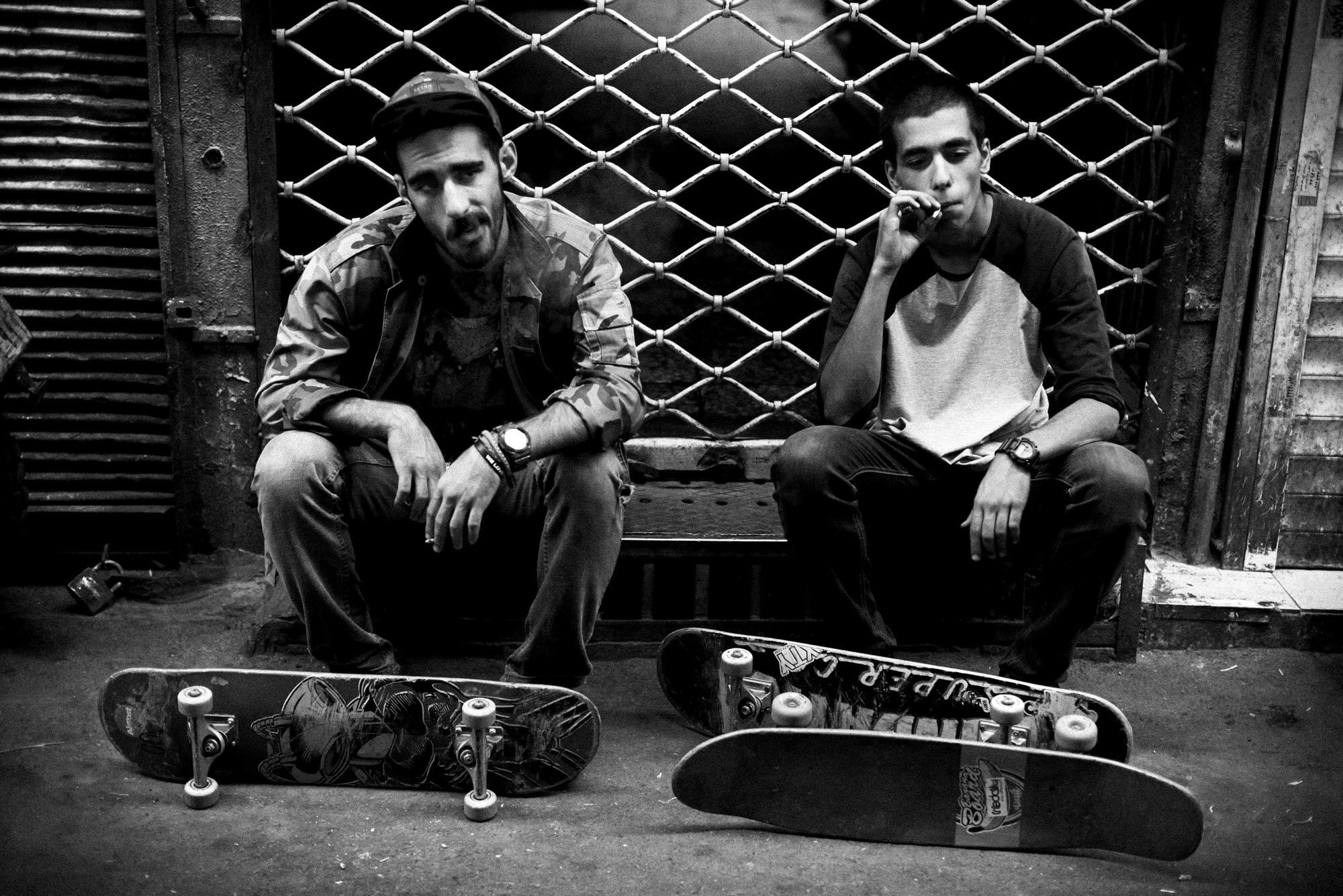  Erfan and Sajad smoke a cigarette during a skateboard session in the Grand Bazaar of Tehran, Iran, on September 24, 2015. 