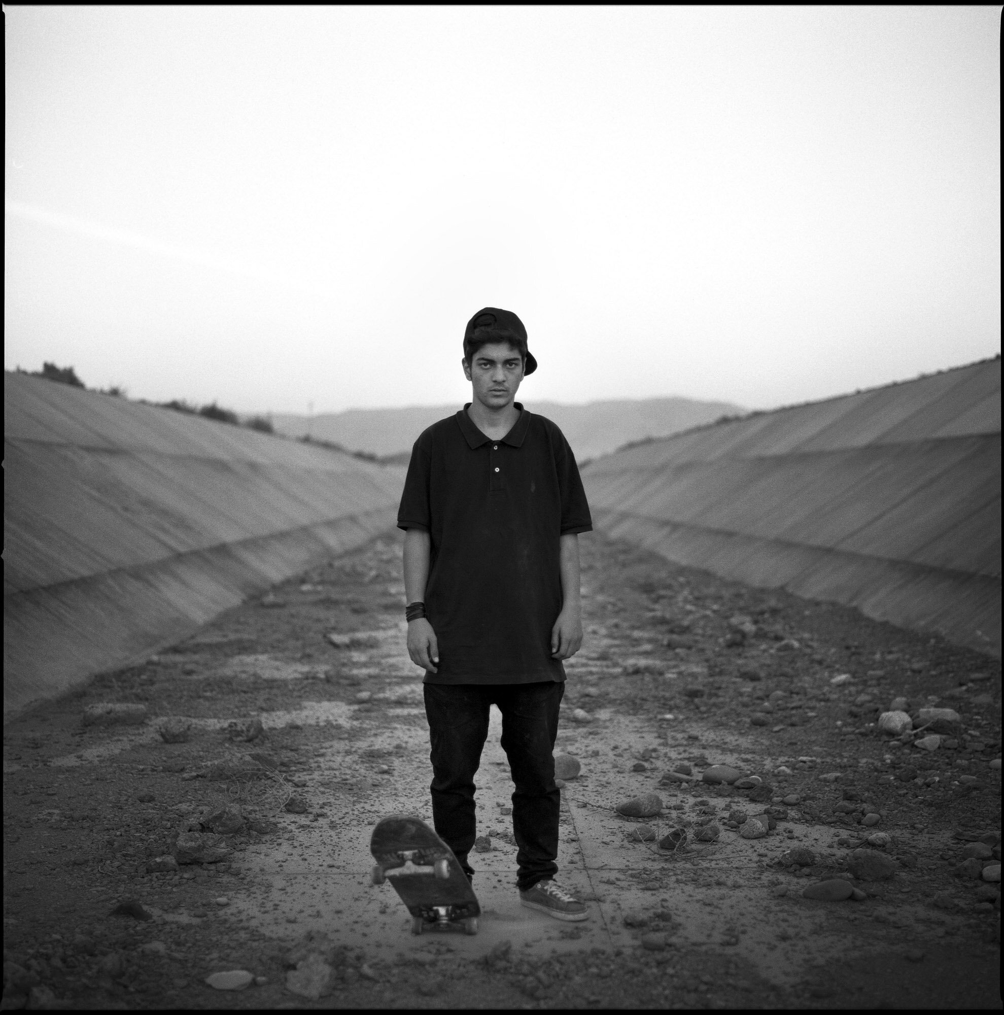  Mahdi, 16 years old, skateboarder from Tabriz, in a ditch on the outskirts of the city. Tabriz, Iran, October 21, 2015. 
