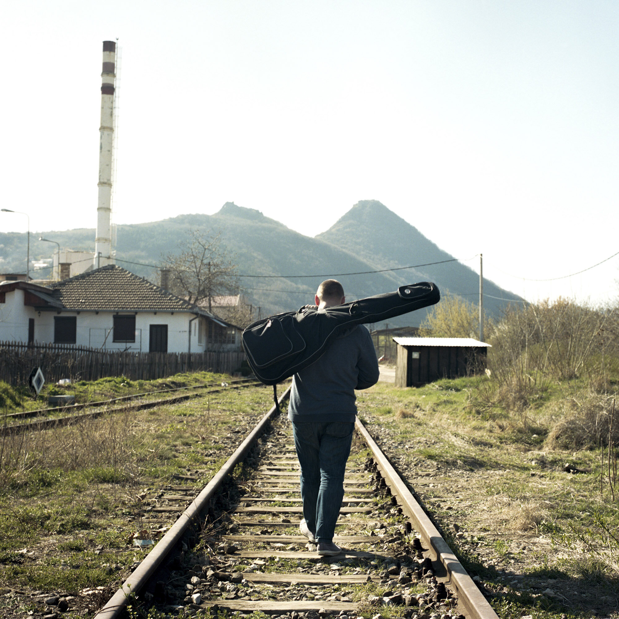  Lazar Mladenovic is a 27 years old musician of Serbian origin. He walks with his bass on a railway located in the Serbian side of Mitrovica, Kosovo, on March 28, 2017. 