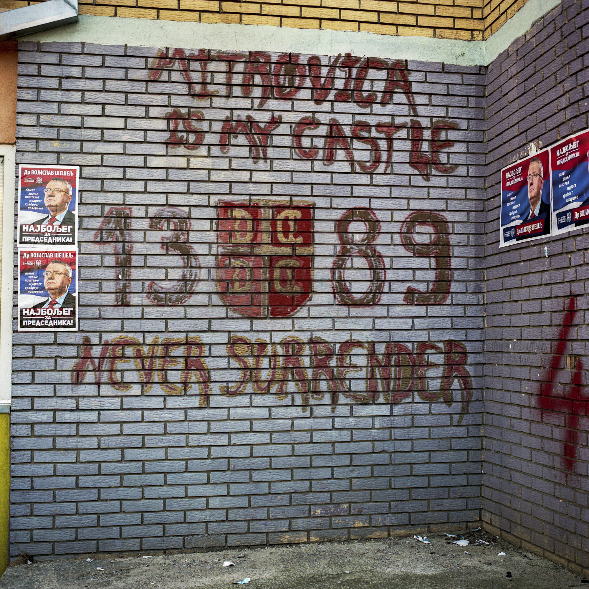 A nationalist graffiti and a candidate's posters for the Serbian presidential elections in Serb-majority north part of Mitrovica, Kosovo, on March24, 2017.