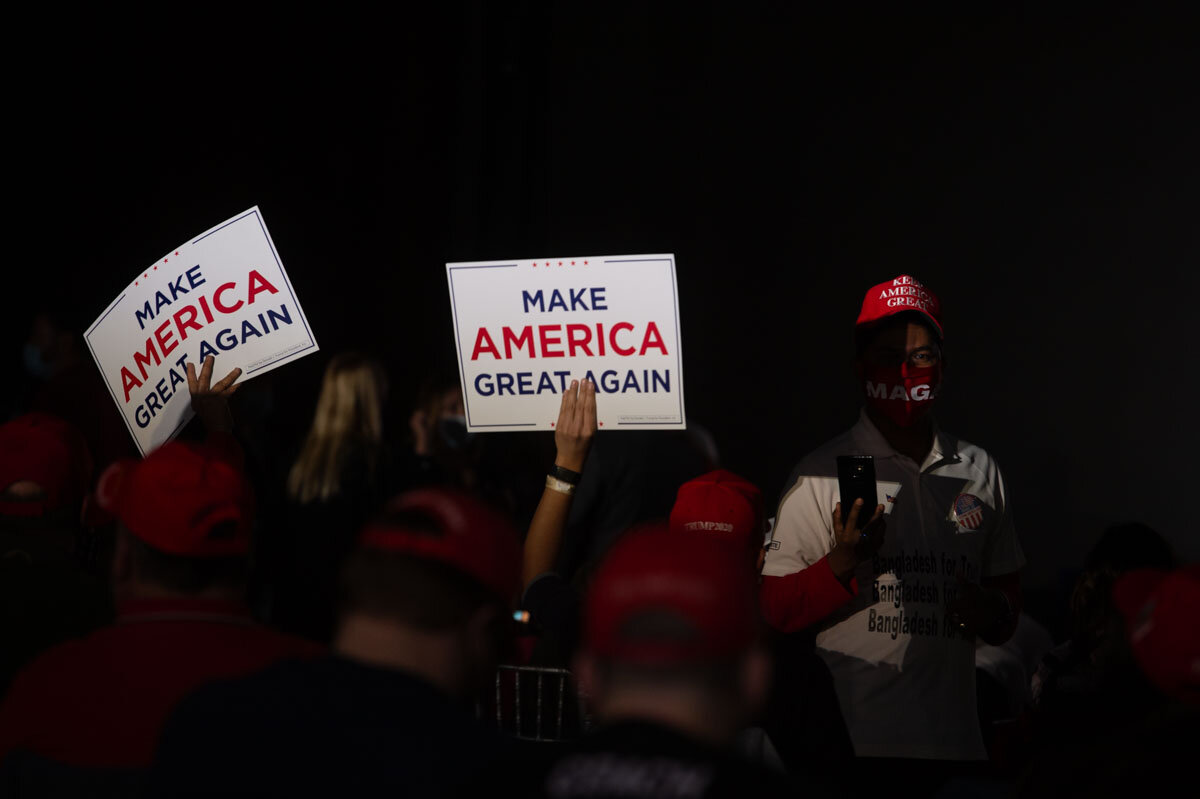  November 2nd 2020 - A trump supporter is holding a 'Make America Great Again' sign during a Trump rally during the US Presidential campaign awaiting for Ivanka Trump. 