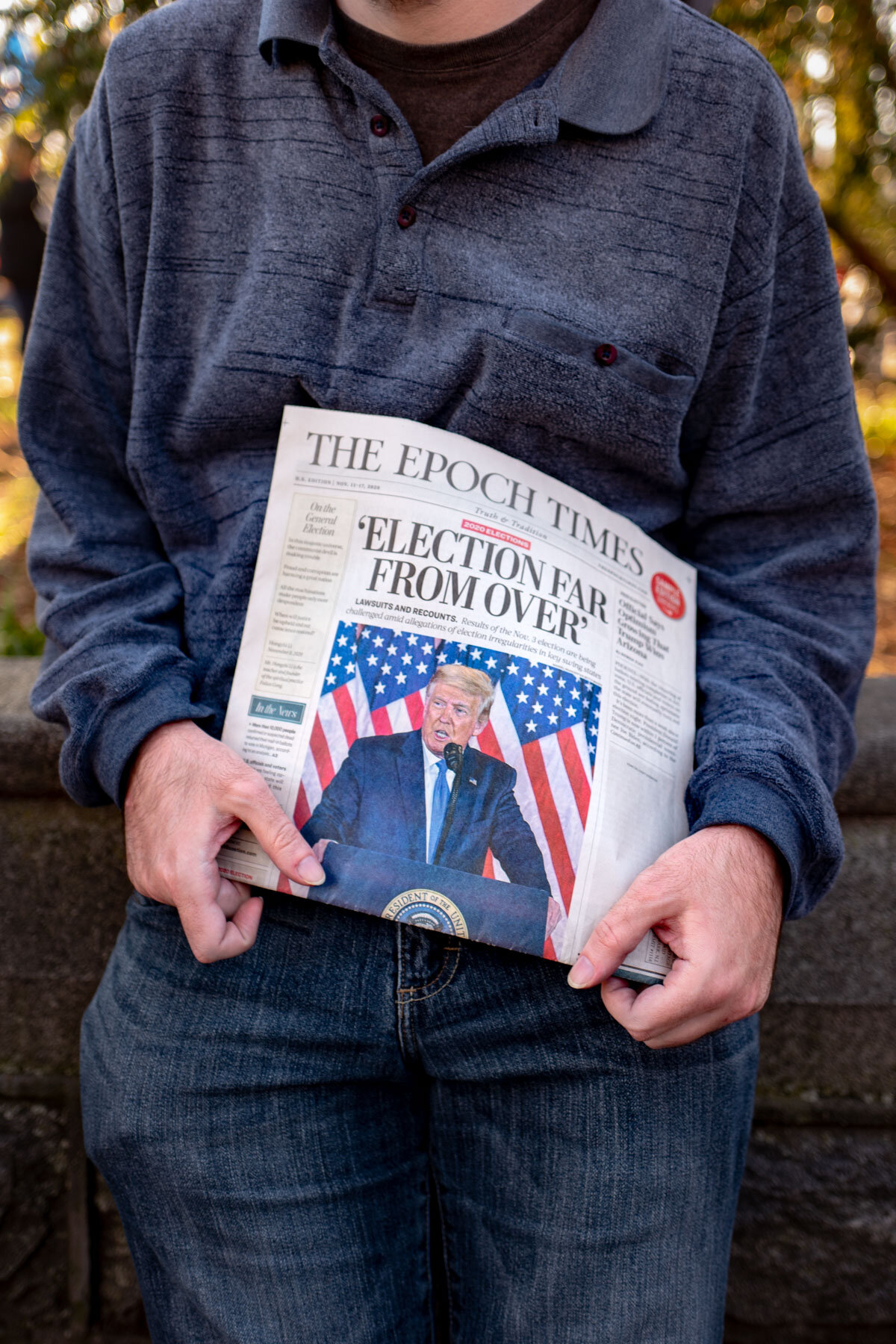  November 14th 2020 - A Trump supporter holds a newspaper during the Million Mega March in Washington. The right-wing newspaper indicates the election to bee far from over, following the declaration of the President Trump claiming victory and making 