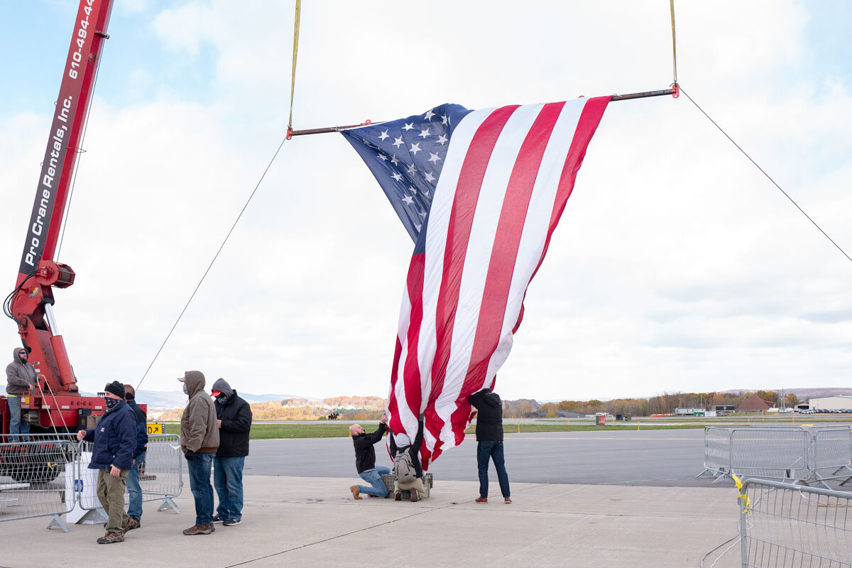  November 2nd 2020 - Technicians workers are folding the American flag back too a box because of too strong winds before the beginning of the last Trump rally before Election Day in Scranton, Pennsylvania, one of the swing states. 