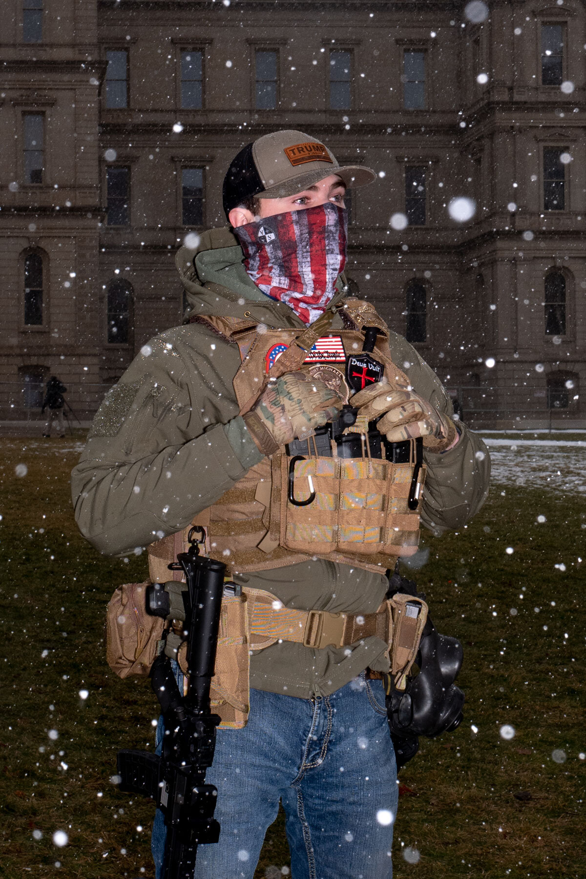  January 17th 2021 - A Trump supporter calling himself 'Preacher' is demonstrating in front of the Michigan State Capitol in Lansing armed and wearing a flack jacket one week after the Storming of the Capitol. He is protesting the results of the US E