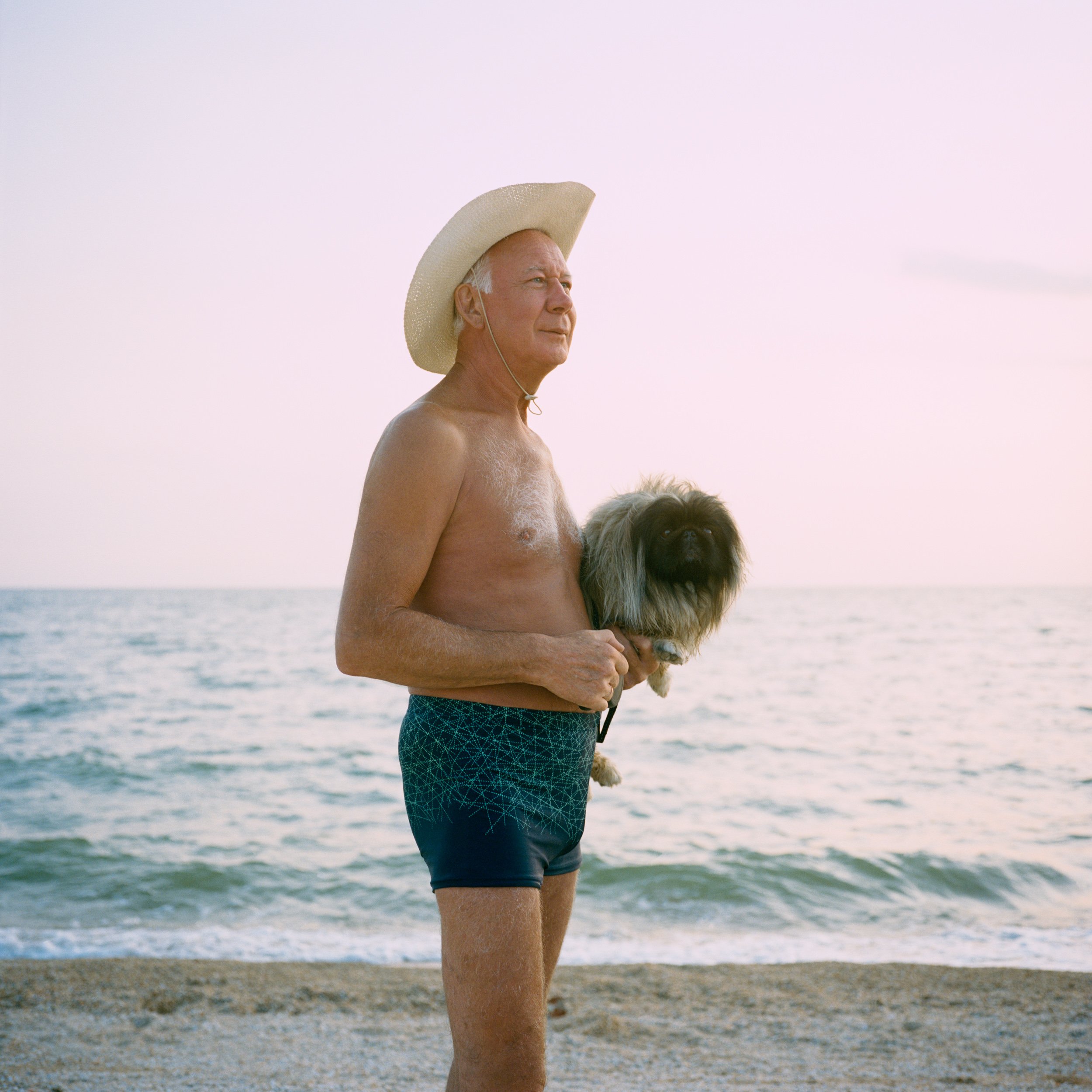  July 2019. Dolzhanskaya spit, Krasnodar Krai, Russia. Mikhail, retired taxi driver from Moscow, is on holiday on the Sea of Azov. 