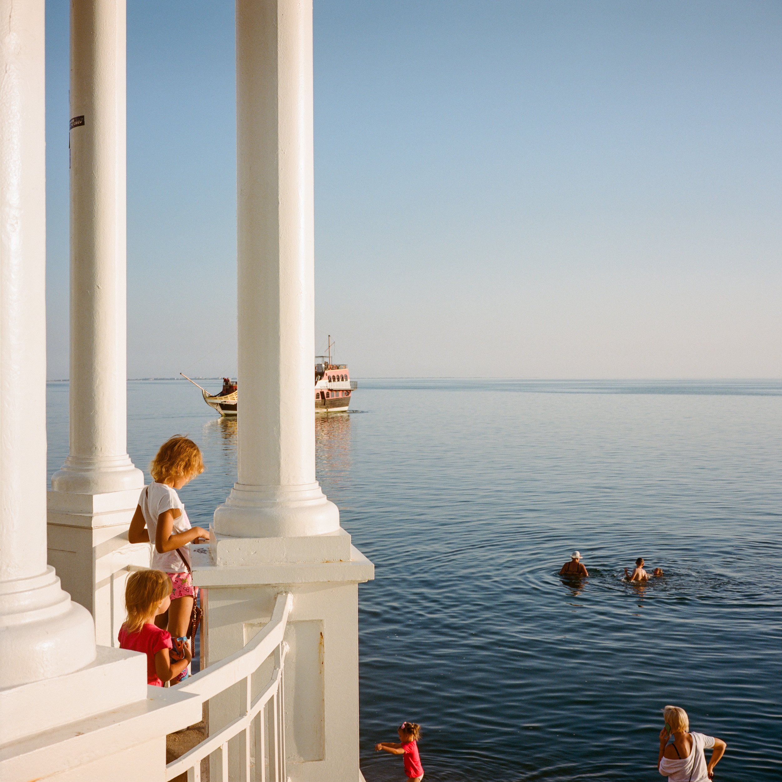  August 2021. Berdiansk, Ukraine. Locals and vacationers by the Azov sea front in the port city of Berdiansk. Berdiansk is on the northern coast of the Sea of Azov. Berdiansk is the second largest Ukrainian sea port on the Sea of Azov after Mariupol.