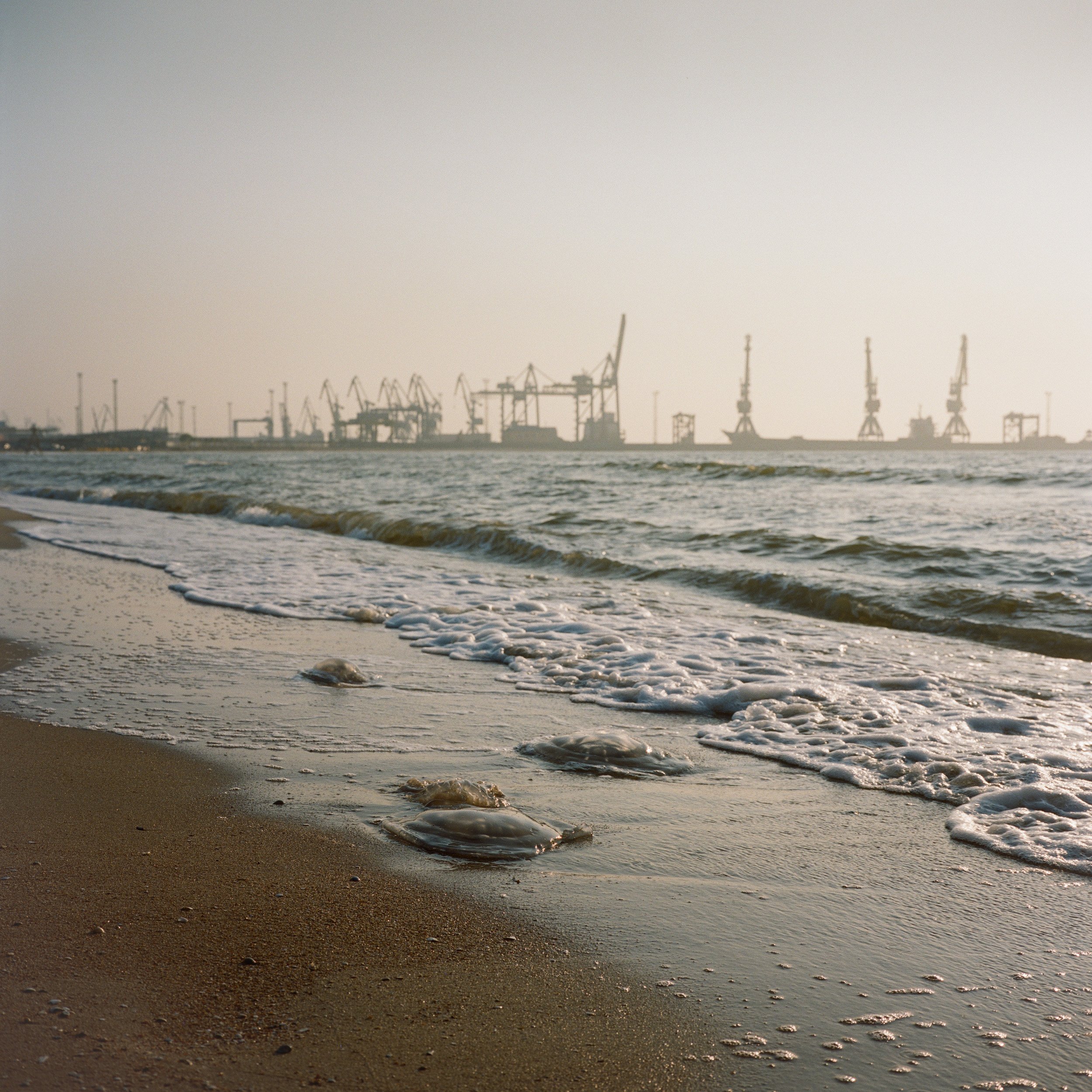  August 2021. Mariupol, Ukraine. The mariupol beach front and sea port in the background. The Kerch Strait is the only connection between the Black Sea and the Sea of Azov, and the only way to reach two important Ukrainian ports,&nbsp;Mariupol&nbsp;a