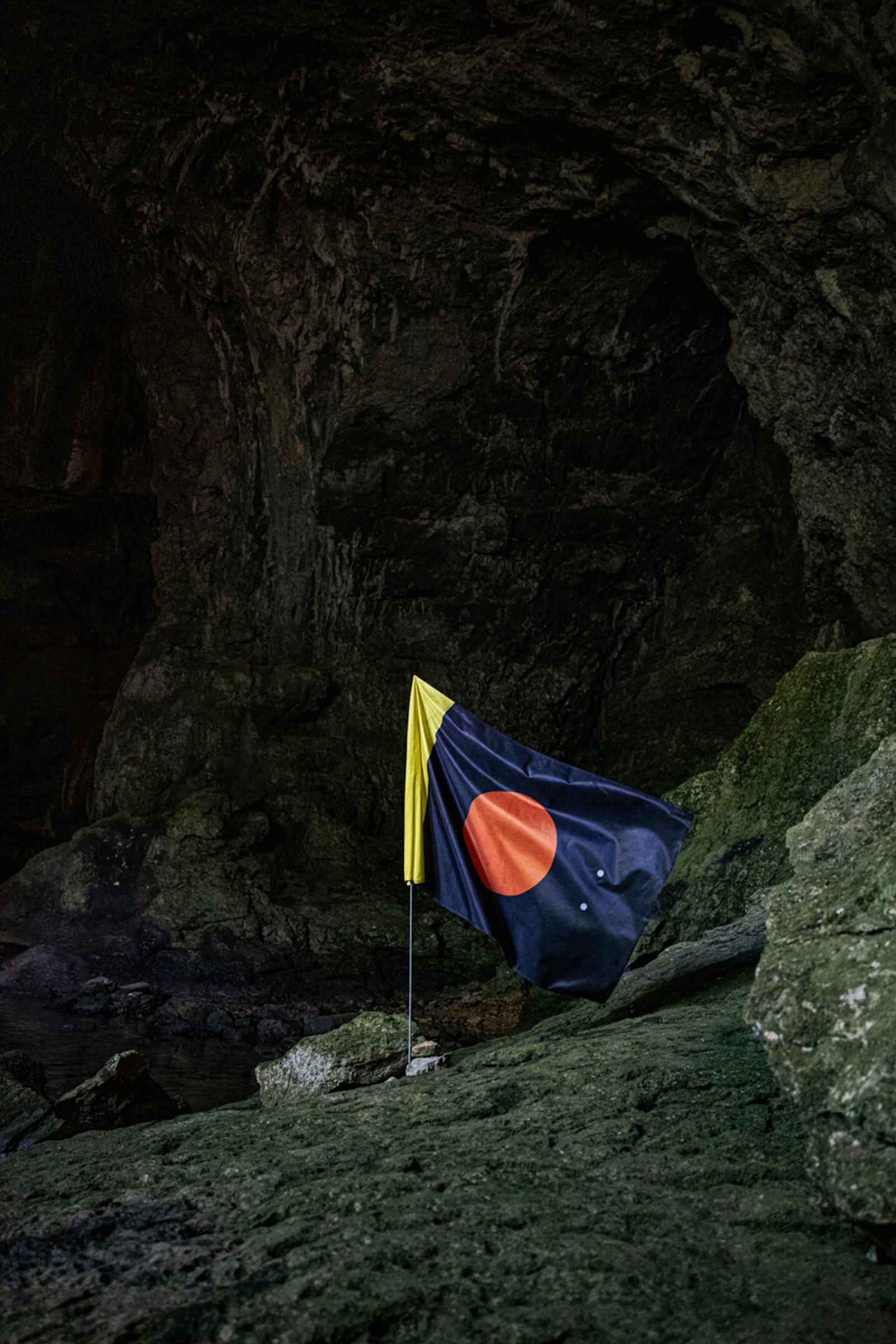  Mars flag made by a Slovenian designer Miha Artnak planted in the cave system simulating the Mars lava tubes. The underground tunnels left behind the running lava could be one of the most suitable living habitats on Mars since they would provide a g