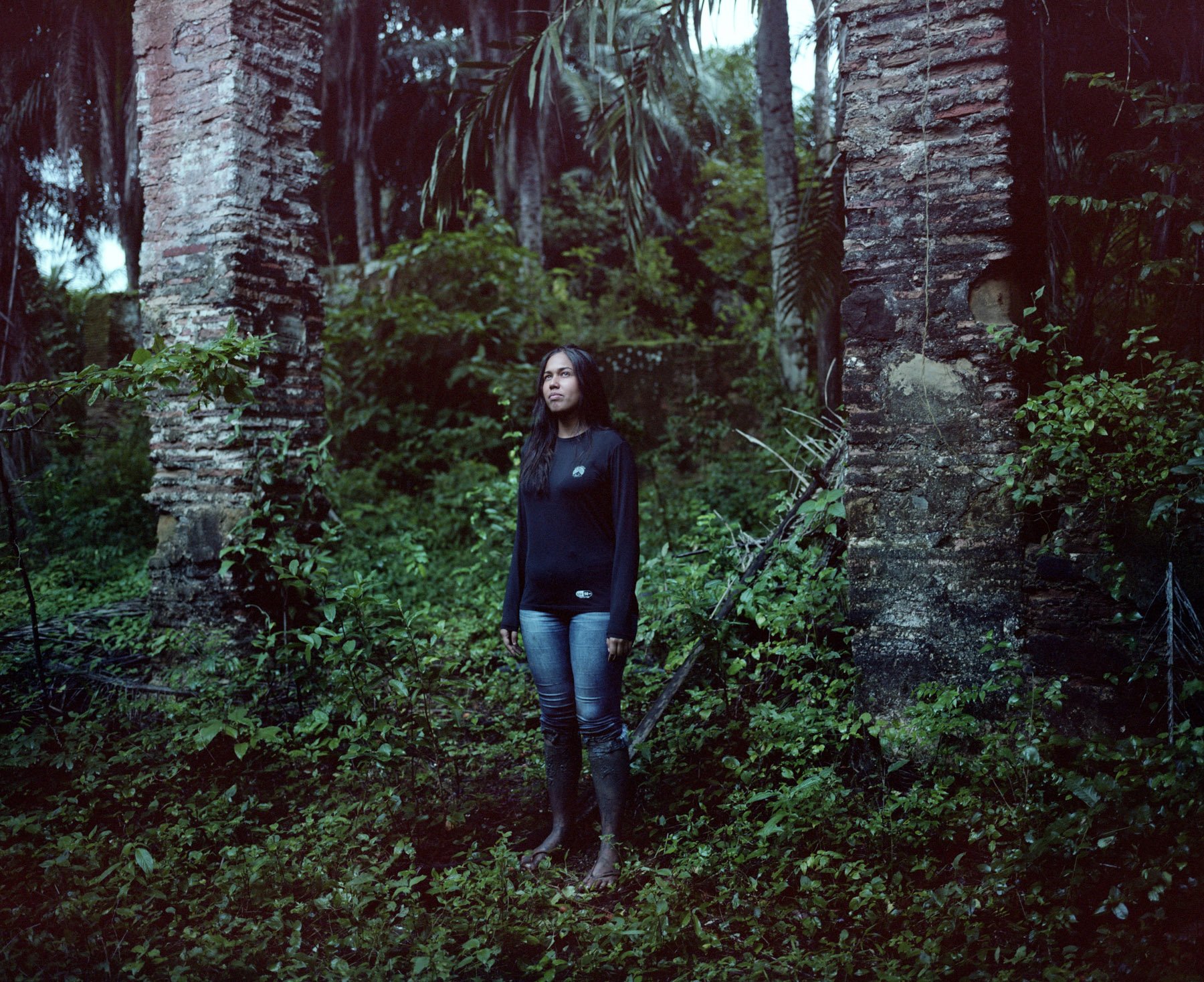  Candeias, Bahia, Brazil, 2022. A Quilombola’s activist stands in the ruins of the engenho, an ancient sugar cane mill and the farm. Most of the workers of the engenho were slaves and ancestors of the members of the Quilombo “Boca do Rio”. The ruins 