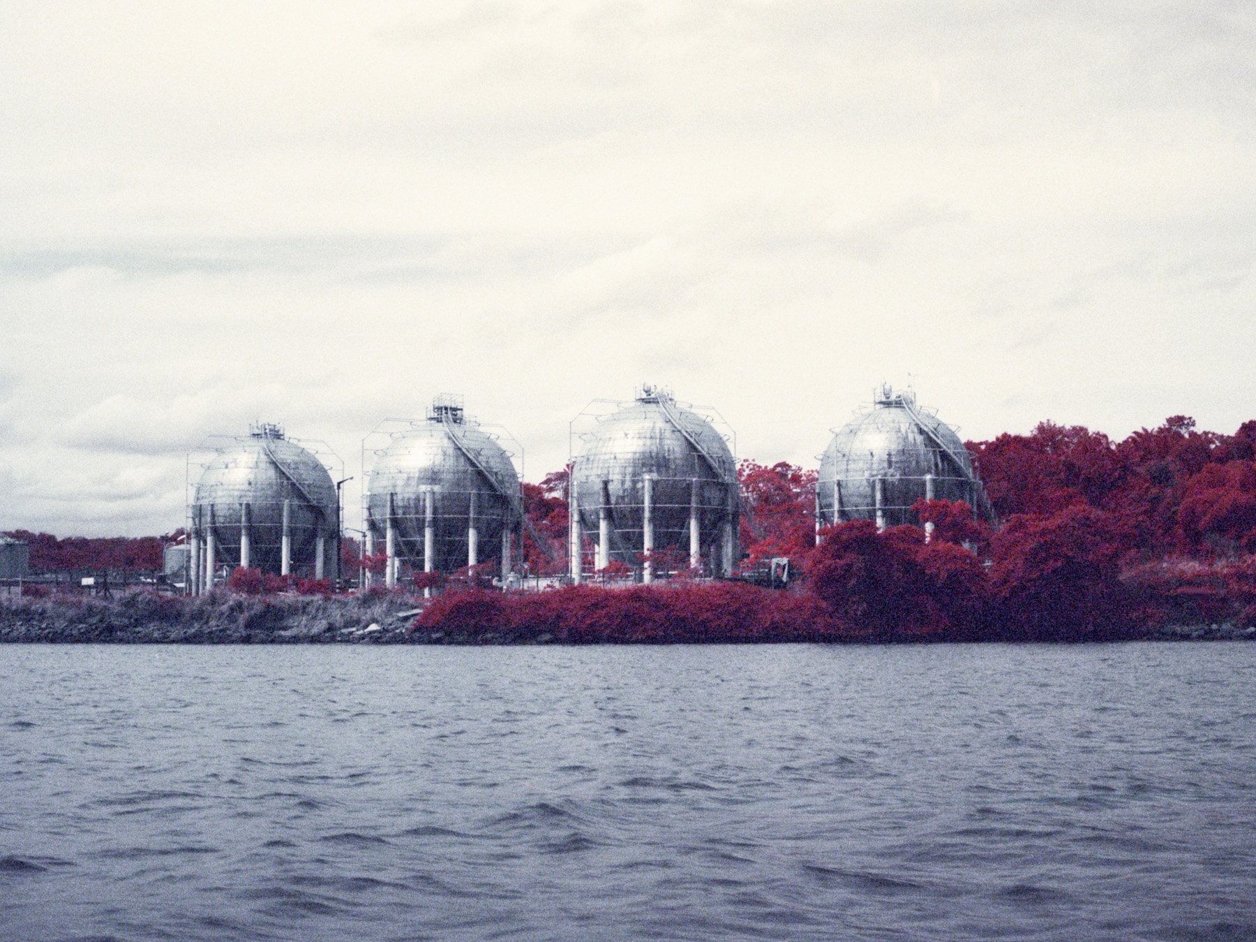  Aratu, Bahia, 2021. An Infrared color image of gas deposits of Aratu Port. The Aratu-Candeias Port that is responsible for the 60% of the cargo ship travelling from and to the Bahia State. With an increase of the industrialisation, increased also th