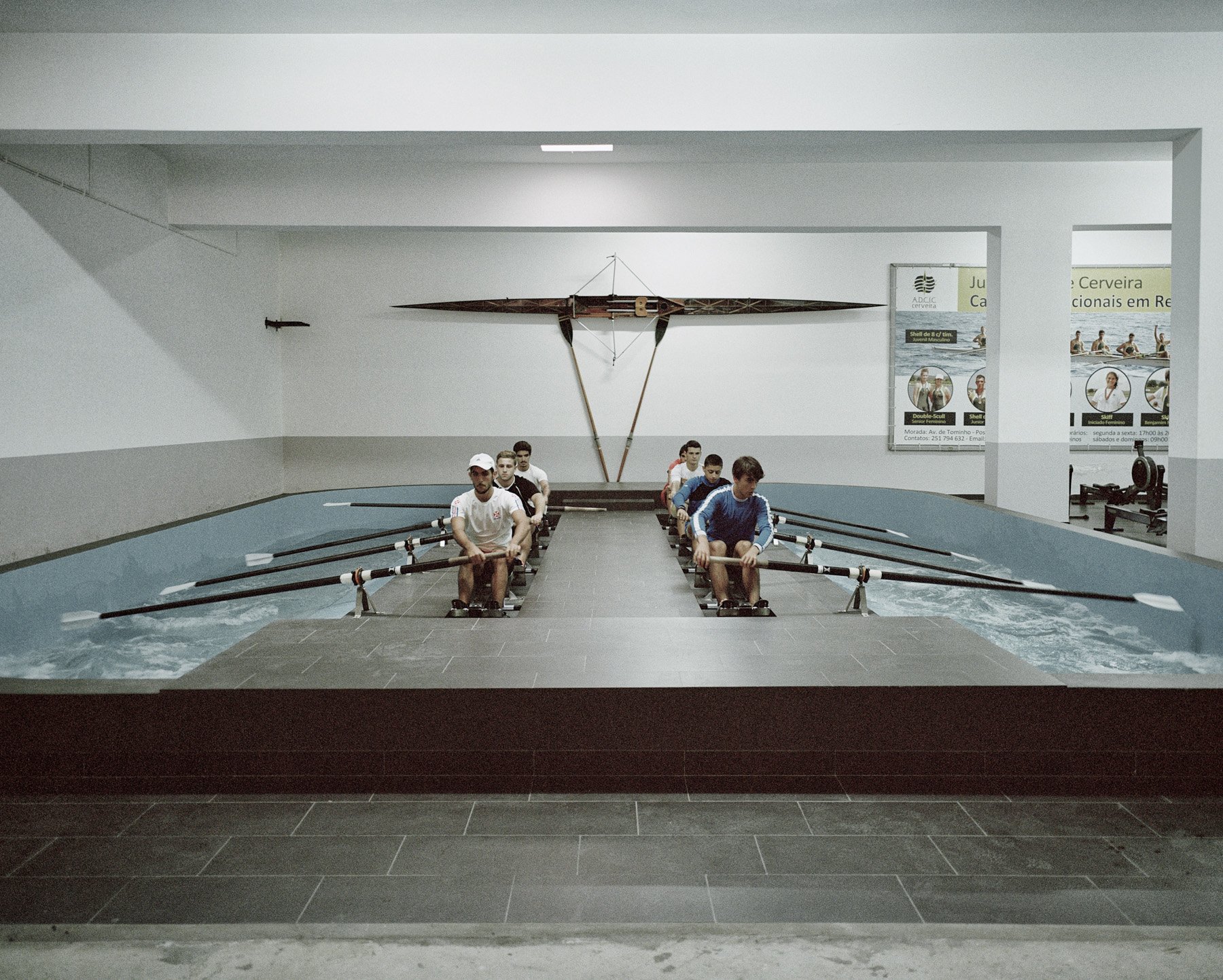  Vila Nova de Carbeira, Portugal, 2014. A team of oar train in an indoor pool loacted in front of the Minho River. 