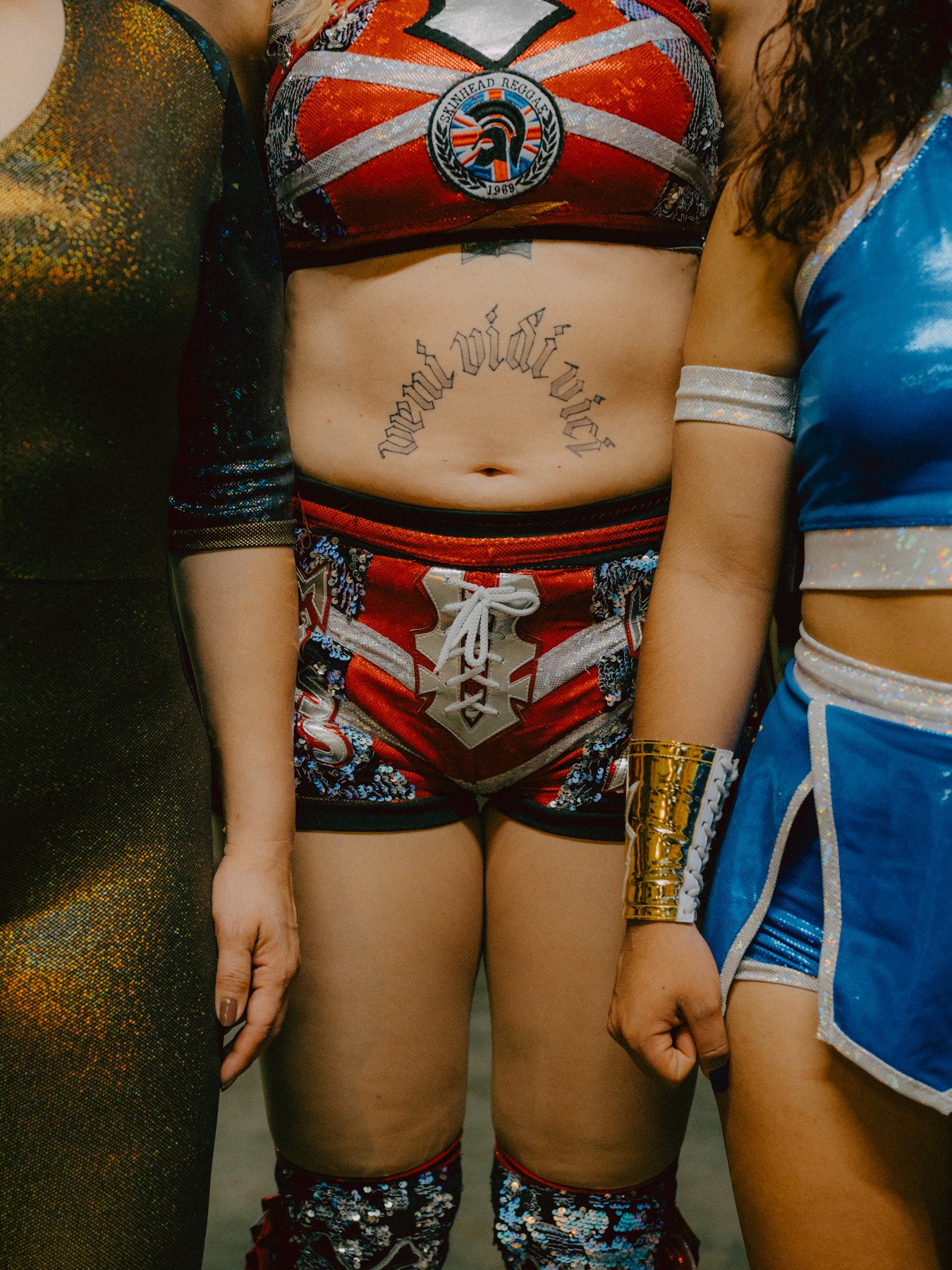 Celeste, Miss Kath, Sayuri (left to right) in their battle outfits. These are made by a tailor especially for the fights.