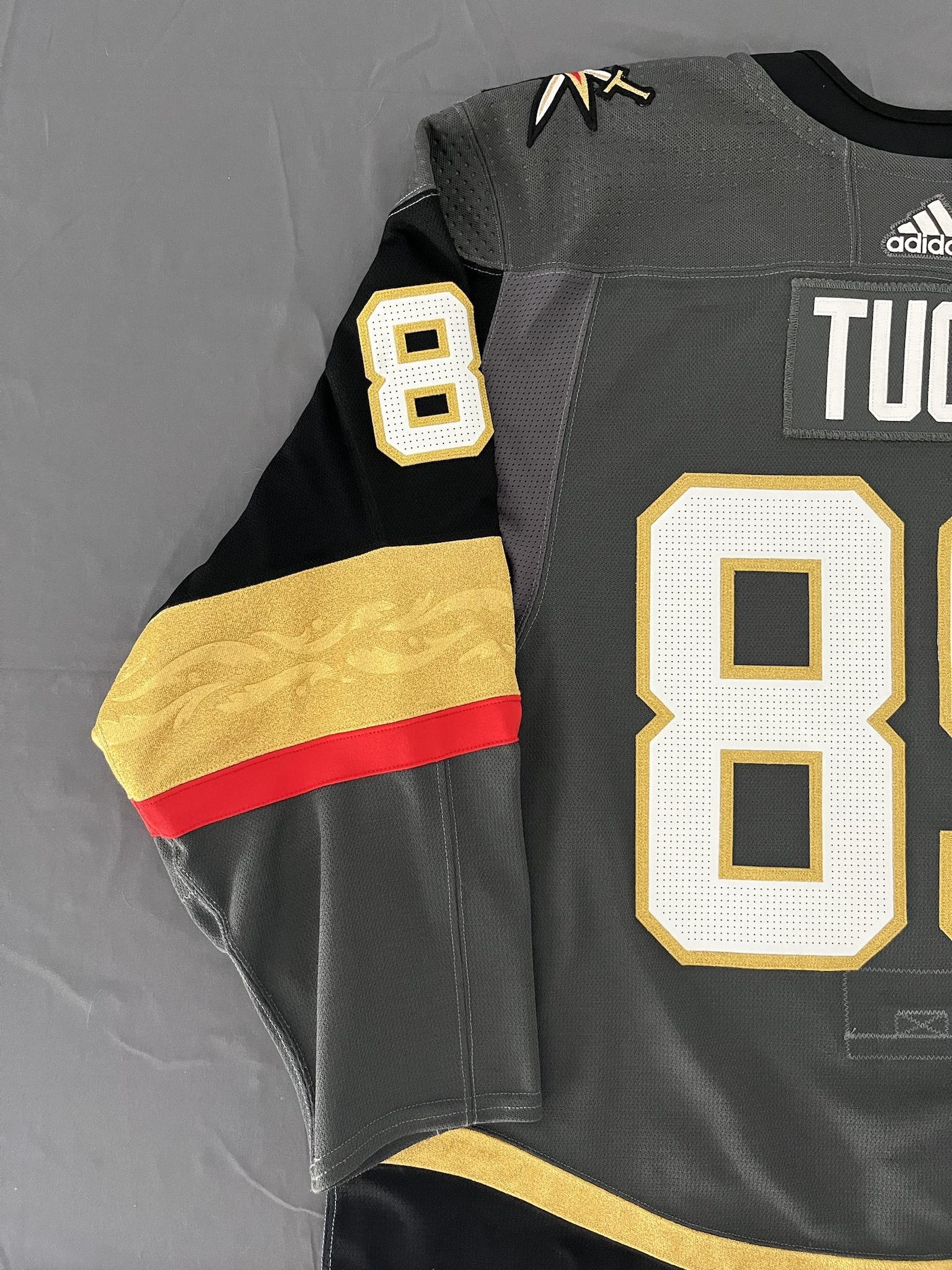 Vegas Golden Knights right wing Alex Tuch (89) wears a jersey commemorating Chinese  New Year du …