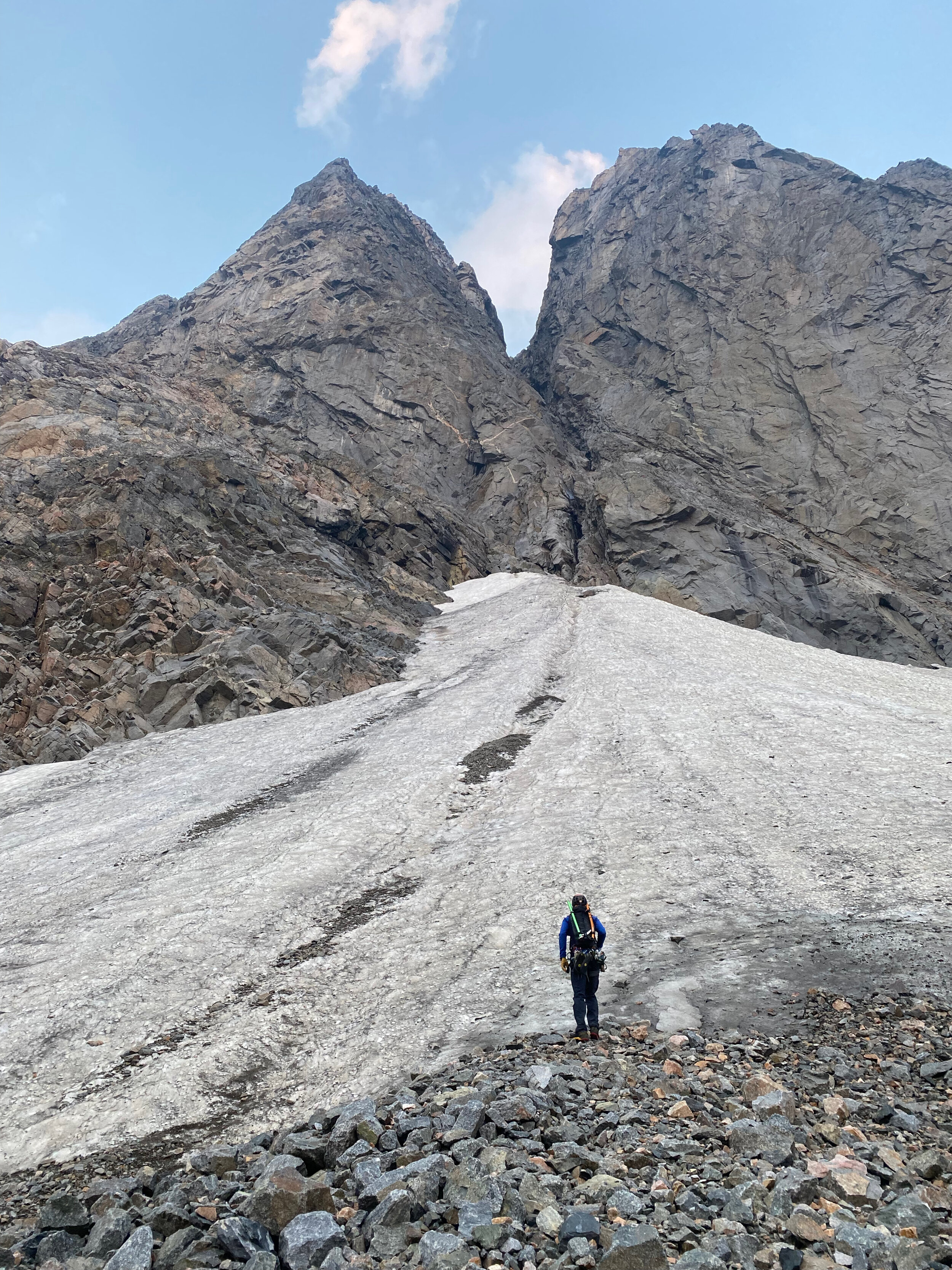 Tucker at the base of the snowfield below Lunar Arete