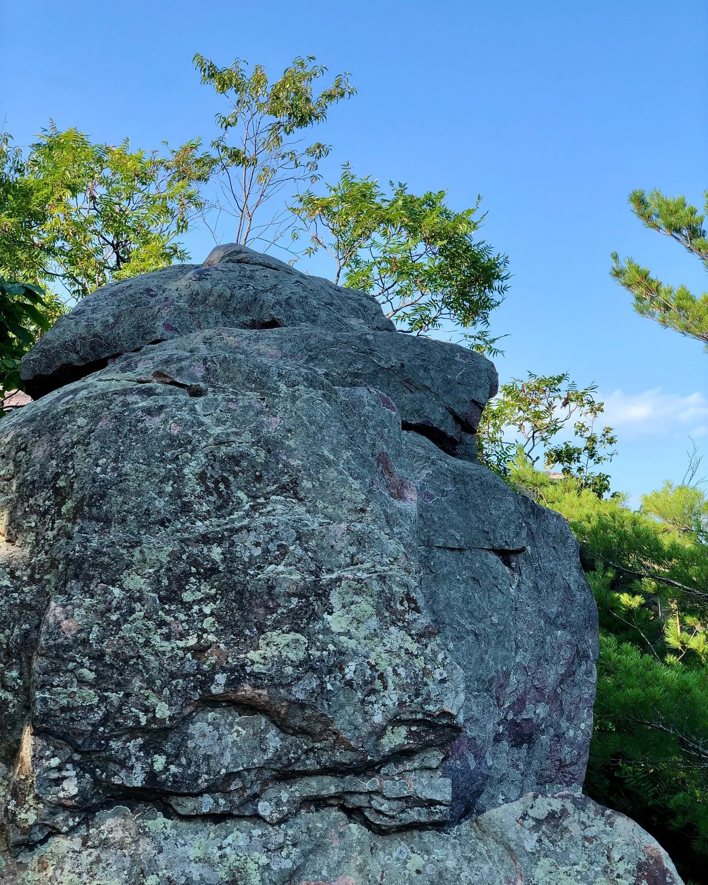 What do you see?

In the first photo, I see a grandfather blowing kisses, and the second photo I see grandmother watching the setting sun, receiving the kiss on her cheek. 

The rocks are even oriented in this way, which you can see in the video.

Th