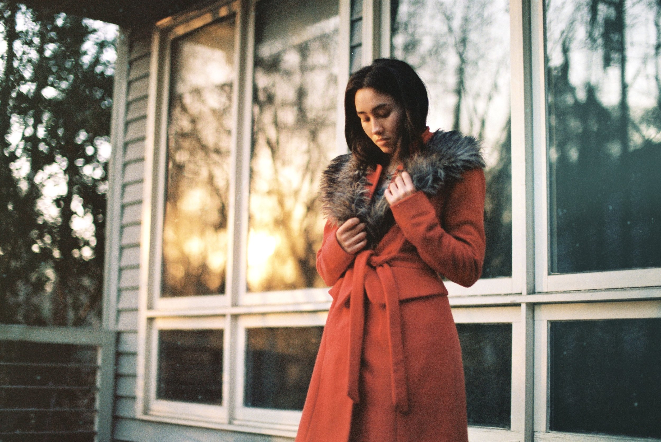Franka, in mom's orange coat, home