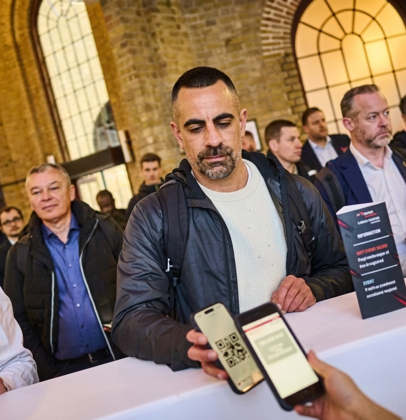 improved image cropped of man scanning QR v2.png