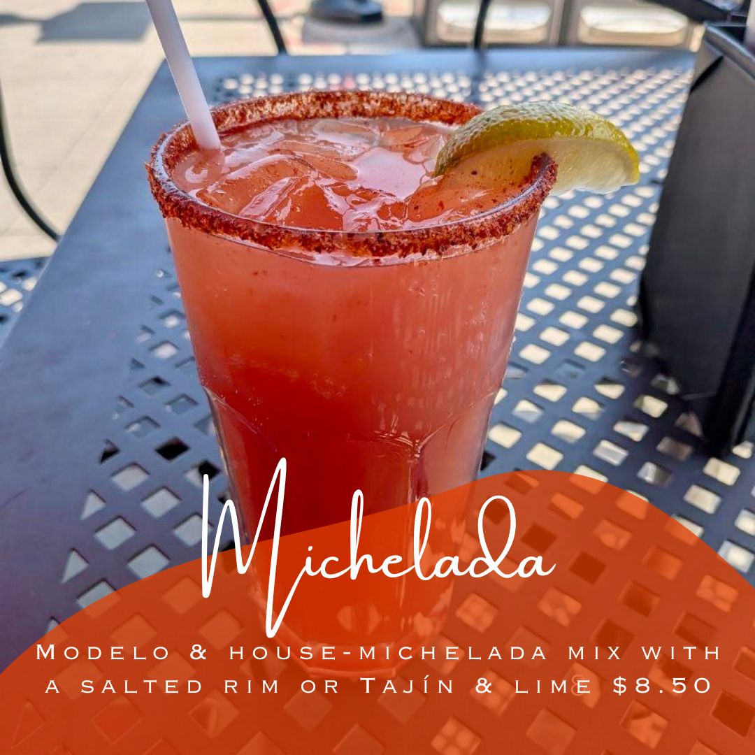 Red/orange iced Michelada beer cocktail on the patio