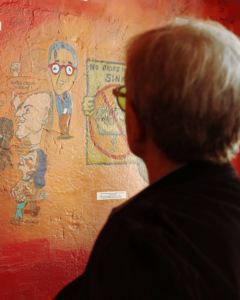 Chuck Morris looks at his new caricature. Photo Credit: Teresa Taylor