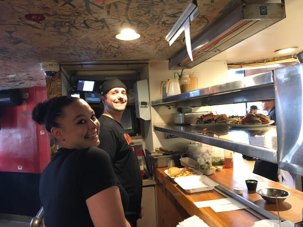 Sink manager and waitress working the expo line