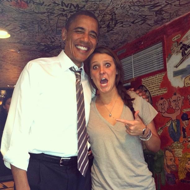 Surprised and happy patron posing with President Obama in The Sink