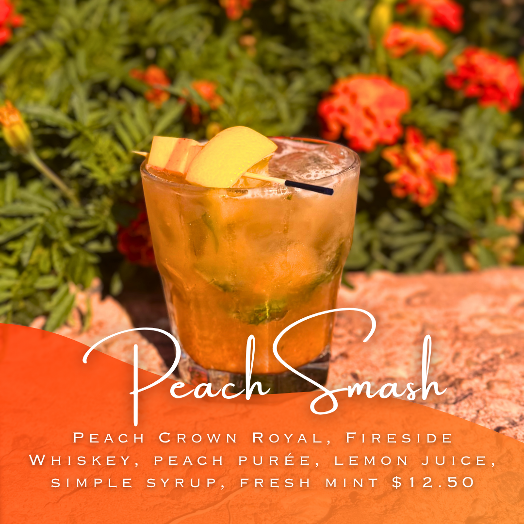 Peach Smash cocktail in front of flowers in the sun