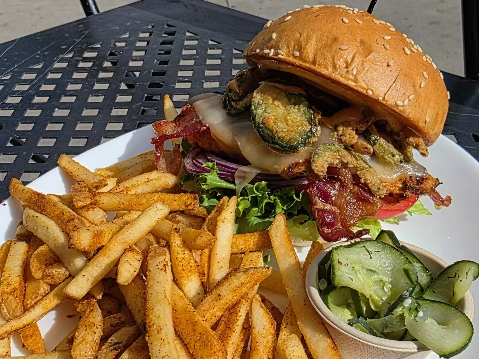 Harissa Havoc Harissa-marinated chicken breast, spicy ranch, leaf lettuce, tomato, red onion, bacon, pepper jack, fried jalapeño coins, and chipotle aioli on a sesame bun. $18.99