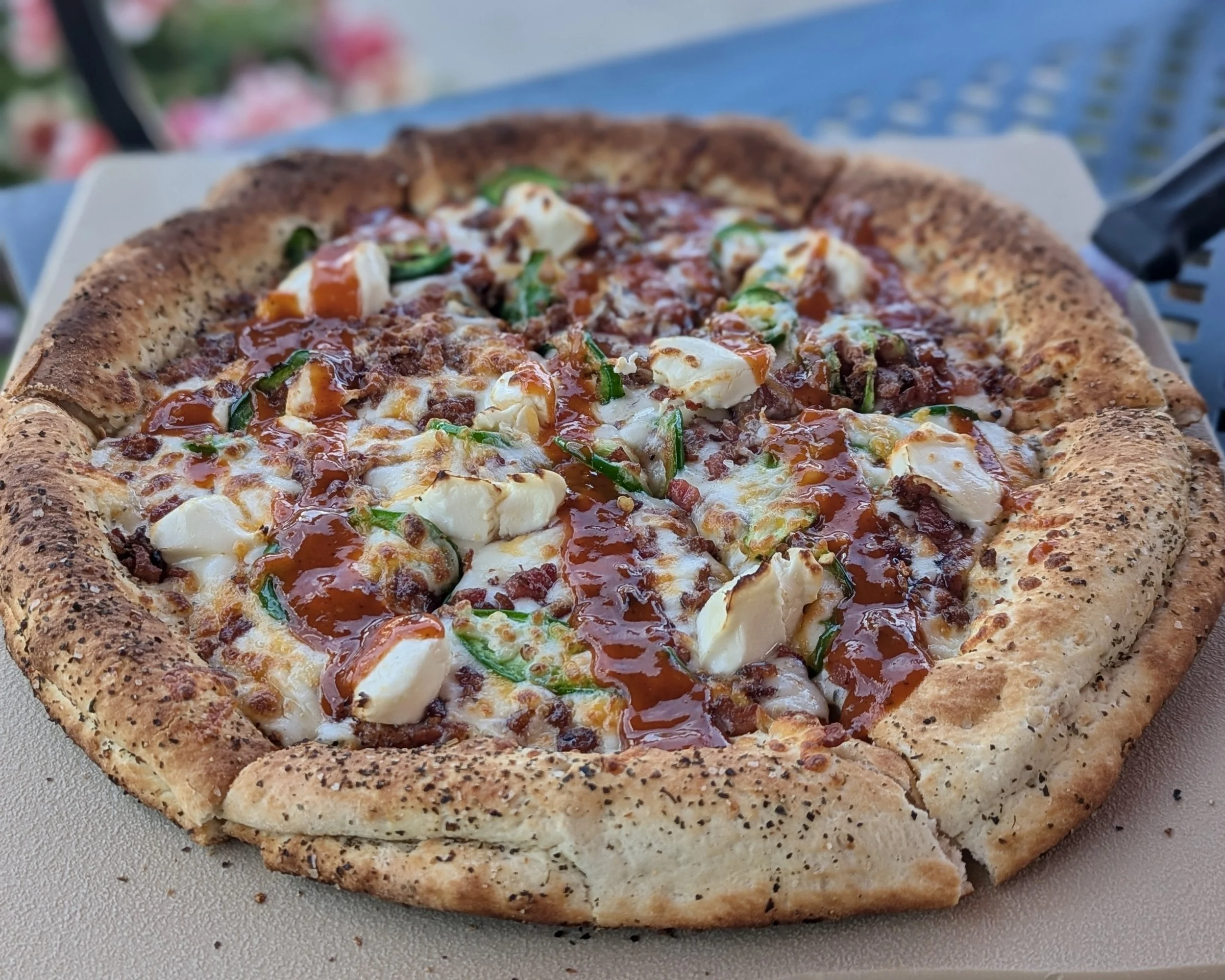 Colorful Colorado-style pizza on The Sink's patio