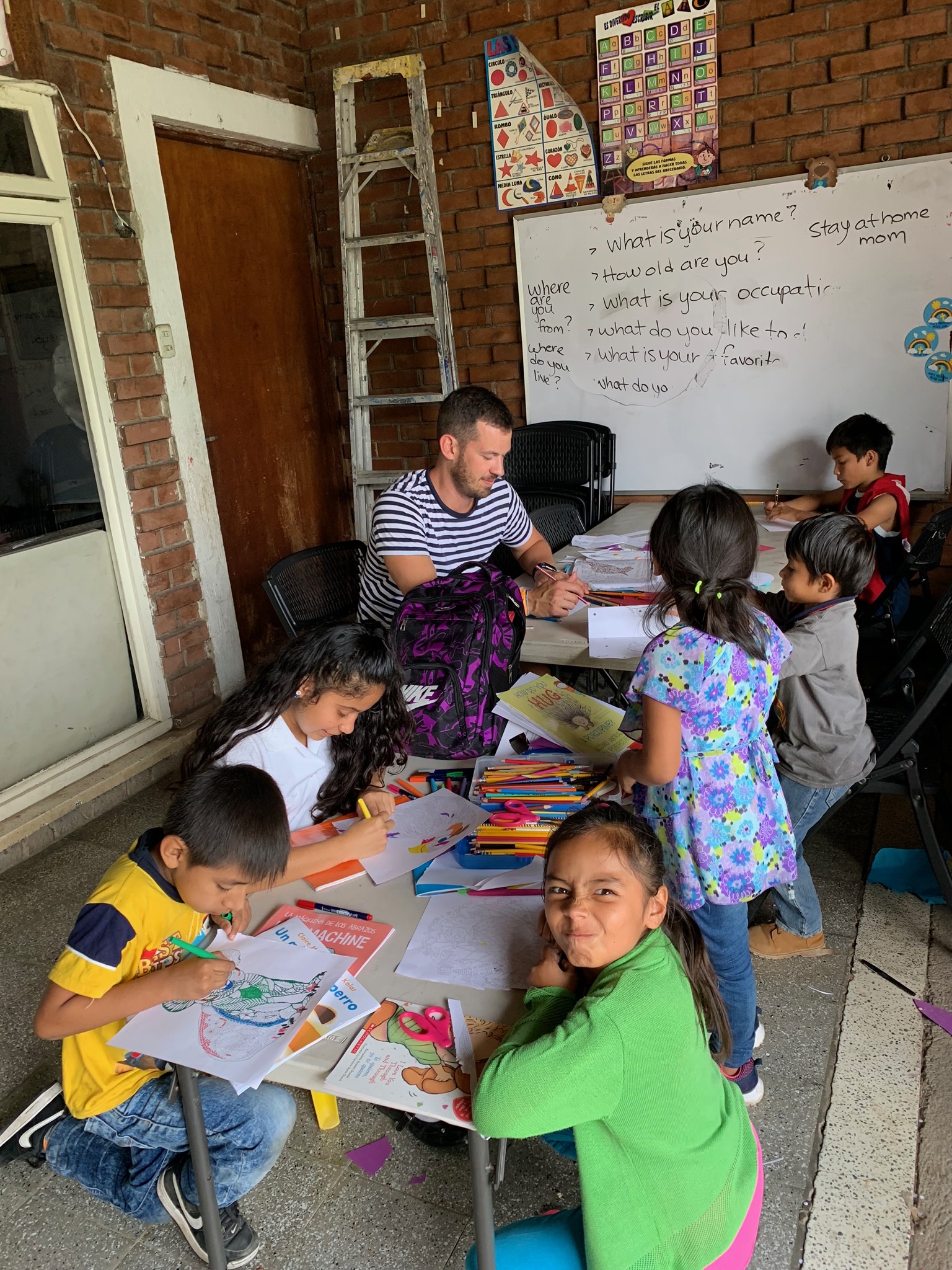 Blake with children on porch.jpg